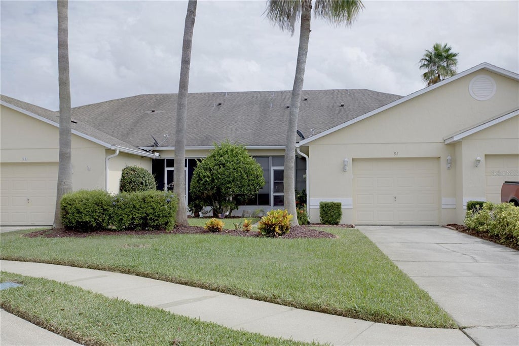 Photo of 91 Club Villas Lane, Kissimmee, FL 34744 (MLS # S5158156)