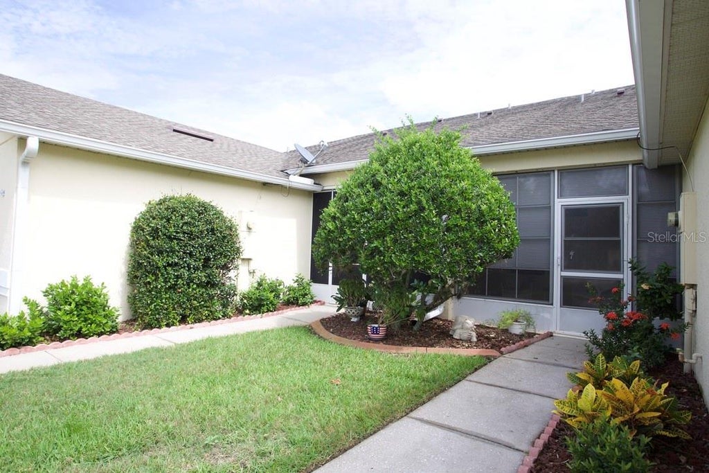 Photo of 91 Club Villas Lane, Kissimmee, FL 34744 (MLS # S5158156)