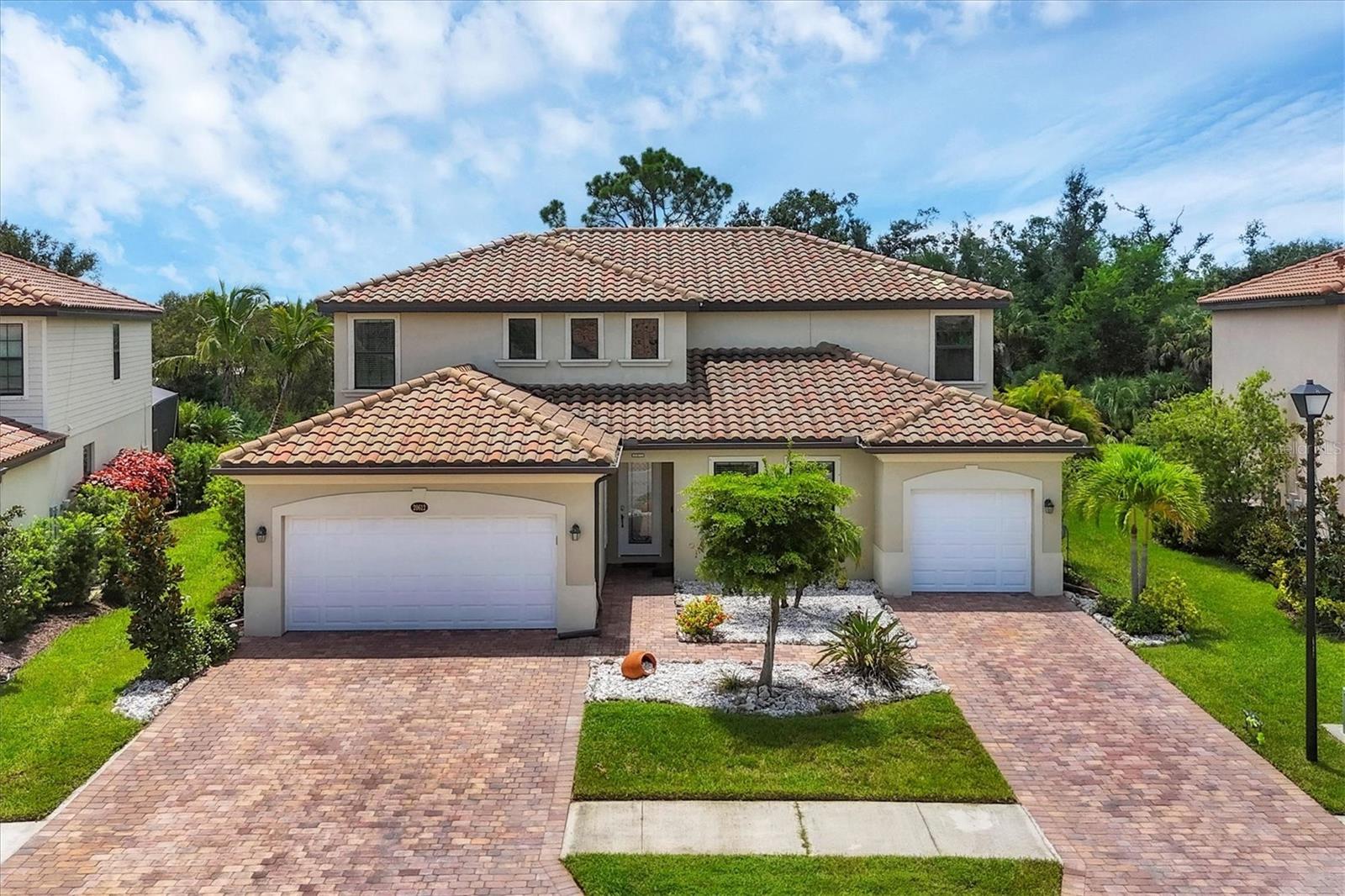 Liberation model multi-generational home. Main home has 5 bedrooms and 3.5 baths. Mother-in-Law suite has one bedroom, one full bath, complete kitchen, laundry closet and private entrance. There are 2 separate garages, a 2 car and a 1 car.
The first floor features an open space connecting the living room, dining room, kitchen and lanai for outdoor living. The second floor includes a loft area surrounded by all five bedrooms, including the owner's suite with a luxurious bathroom. Home is maintenance free.
Community has resort amenities and lifestyle with resort-style pool, clubhouse, fitness center and sport courts.
Community is 10 minutes' drive from downtown Venice and beautiful Gulf of America beaches.