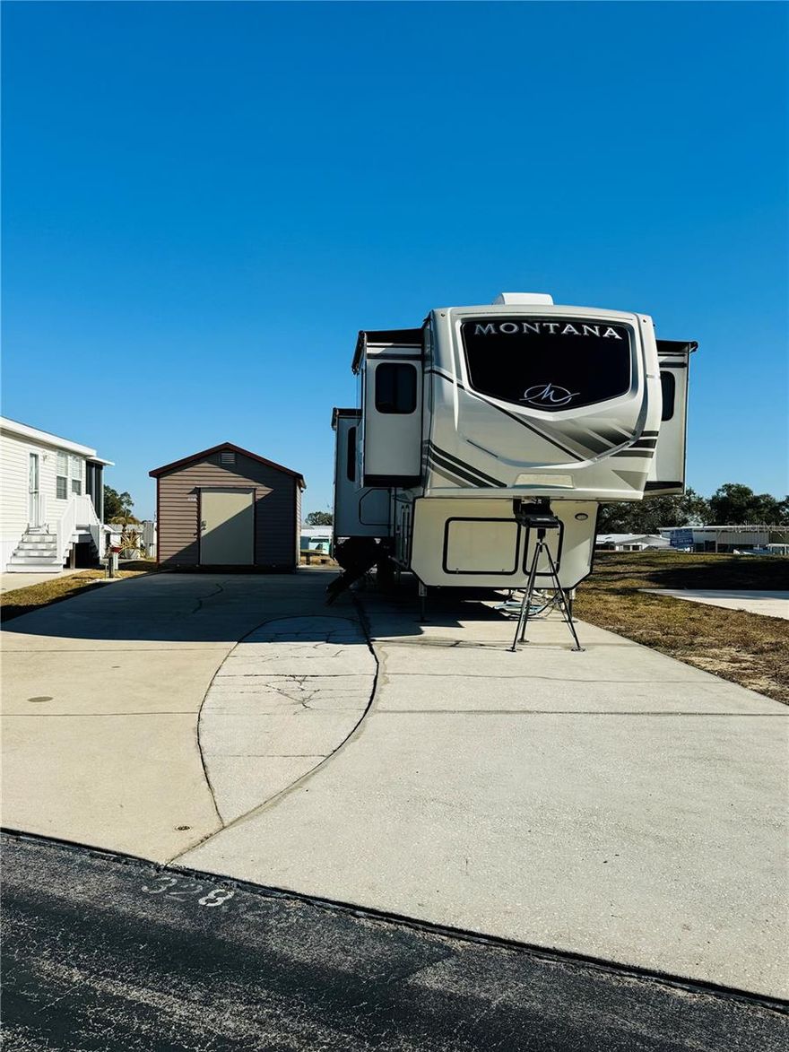 WELCOME TO DEER CREEK RV GOLF & COUNTRY CLUB!  Enjoy 55+ RESORT STYLE LIVING on this amazing RV LOT with 10 x 16 SMITH BUILT SHED with electric. Located in the highly sought after OSPREY POINT COMMUNITY, overlooking the 5th Hole of the golf course!  The backyard is perfect for entertaining with family & friends, watching the shuttle launch, fireworks from Disney or just enjoying the serene view of the golf course!  If you’re looking for a place to park any type of RV, Class A, Fifth Wheel or Trailer, this is the lot for you! You can even build a CASITA! Enjoy OSPREY POINT’S heated pool, shuffleboard courts & clubhouse with tons of fun activities just a golf cart ride away! If you love RESORT style living, this RESIDENT OWNED 55+ GATED OASIS checks all the boxes! Deer Creek Community has it all! Deer Creek's MAIN CLUBHOUSE offers a variety of social events throughout the year such as Karaoke, Trivia, Yoga, Group Exercise, Crafts, Swing Dancing, Bingo & more!  Soak up the sun at Deer Creek’s MAIN pool, cabana & hot tub area! Try water volleyball, pickleball, tennis, shuffleboard or pool aerobics!  Love golfing? Check out Deer Creek’s 18 Hole Executive Golf Course, Leagues & shopping at Pro Shop!  Rated #3 Most Improved Golf Course in the US by Golf Advisor (2015) with Power Tee automated teeing system.  The Tiki Bar is a great place to meet new friends with occasional live bands & music! The Greenside Grill is perfect for onsite dining!  The Greenside Deli offers ice cream, deli sandwiches & dinners to go. Deer Creek is centrally located in Davenport just 20 minutes from Disney & all the attractions that families enjoy! Hop on your golf cart & ride to many restaurants & shops nearby. Bealls, Marshalls, Target & Star Bucks are in Posner Park less than a mile away! A new Publix is opening just across the street!  Ideal for full-time residency or seasonal getaways!  Call today to view this HIDDEN GEM in sunny Florida! Just 1.5 hours to each COAST! Looking for a slice of paradise?  Let us show you Deer Creek today!