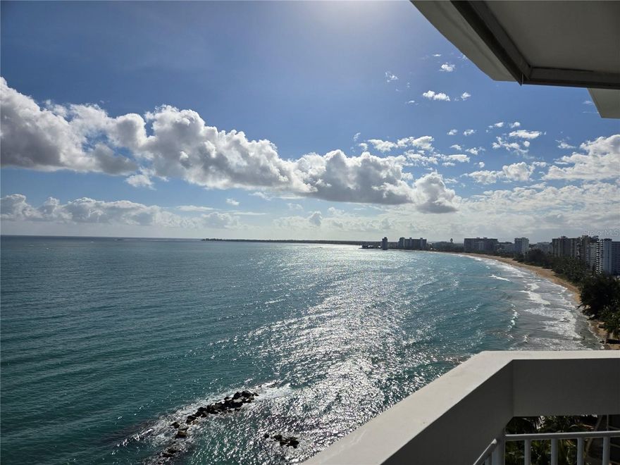 A rare opportunity to acquire a high-floor residence at The Galaxy Condominium, set directly on Isla Verde Beach — consistently ranked among the world's top ten urban beaches. Units with these breathtaking 180-degree panoramic ocean views seldom come to market. An added advantage unique to this building is a man-made breakwater that creates a year-round natural shallow pool ideal for families and young swimmers, while the full expanse of Isla Verde's two-mile open shoreline remains just steps away. Thoughtfully appointed amenities include a pool and outdoor grilling area. Nestled in a vibrant pedestrian corridor abundant with diverse restaurants and eateries, and just minutes from Luis Muñoz Marín International Airport and Old San Juan. Island living at its finest.