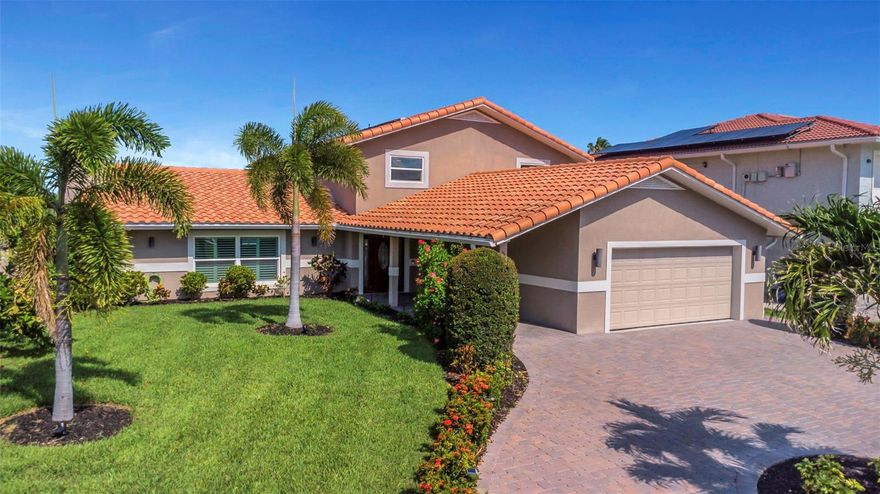 HELLO GORGEOUS!! Live every day like you are on vacation in this SPECTACULAR WATERFRONT PARADISE with unmatched luxury finishes! Luxurious Waterfront Retreat with Premium Upgrades, DIRECT GULF ACCESS & Spectacular Sunsets. Move-in ready and meticulously remodeled, this exceptional 4-bedroom, 4-bath WATERFRONT home in the coveted Gulf Harbors/Flor-A-Mar community offers over 3,100 square feet of refined coastal living. With deep-water Gulf access, premium finishes throughout, and spectacular sunset views over the water, this property is a rare find for those seeking both elegance and adventure. Enjoy 70 feet of waterfront, a private dock with 14,000 lb BOAT LIFT, JET SKI DOCK, and quick access to world-class fishing, sandbars, and open Gulf waters—ideal for the ultimate boating lifestyle. Inside, the home impresses with an open-concept layout, soaring ceilings, and energy-efficient LED lighting. The chef-inspired kitchen features custom KraftMaid cabinetry, granite countertops, Samsung Bespoke AI Appliances, a walk-in pantry by California Closet Design, KitchenAid appliances, an induction cooktop, and an oversized peninsula with bar seating—perfect for entertaining. The great room dazzles with a marble fireplace and professionally installed surround sound audio system (also installed in the family room). This home offers TWO LUXURIOUS OWNER'S RETREATS, one on each floor. The main-level suite includes a spa-style bathroom with a gorgeous 25 sq ft walk-in shower, quartz countertops, and a solid wood closet system. The top-floor owners retreat showcases a marble en-suite bath and custom walk in closet. The second bath features a soaking tub, custom tile shower, dual vanity with granite counter tops. Upstairs also includes two additional bedrooms (or one plus a bonus room/home office) with generous closet space. Additional highlights include tray ceilings, crown molding, solid-core doors, plantation shutters, luxury vinyl plank and tile flooring, and smart home integrations (smart locks, thermostats, Ring system, and automated sprinklers). Impact-rated windows and doors THROUGHOUT home. Two OLED LG 4K TVs are included. Step outside to your private backyard oasis, where you’ll enjoy a resurfaced saltwater pool featuring a cascading waterfall spout, updated pool equipment, solar heater, paver patio, ambient LED lighting, outdoor ceiling fans and nightly displays of vibrant sunsets over the water. The dock features, composite decking, stainless hardware, and dedicated electric/water hookups—ready for your boat and water toys. All major systems have been updated, including electrical, plumbing, HVAC vents, hot water heater, insulation, impact-rated windows and doors, and a new 8-zone irrigation system. Garage includes a polyaspartic floor, new pvc baseboards and custom storage. No HOA. No CDD fees.  INCLUDES ACCESS TO PRIVATE BEACH! Located in one of New Port Richey’s most desirable waterfront communities with great neighbors and unmatched boating access. Ask for the full list of high-end upgrades—too many to list! This is your chance to own a truly turn-key luxury waterfront home with dual owner’s suites and unforgettable sunsets.  MOVE IN READY...This is YOUR HOME!