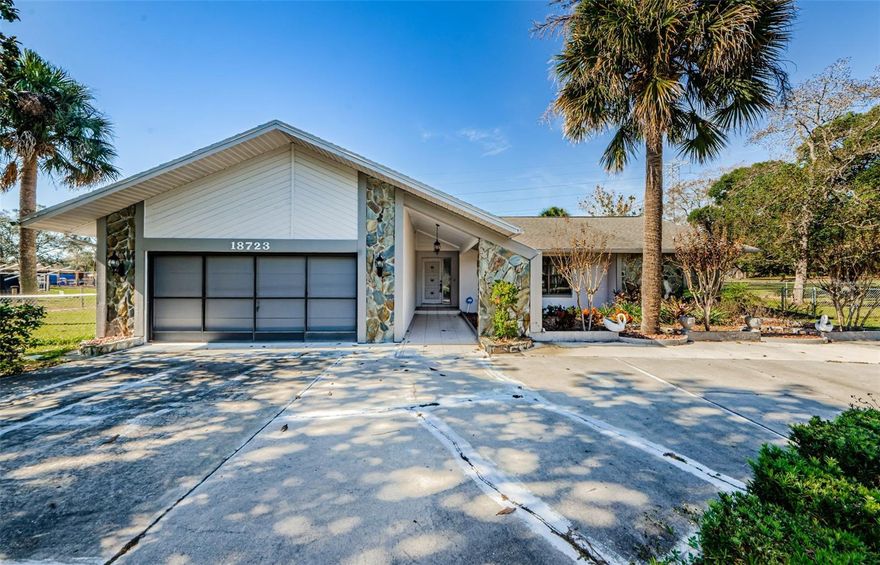 Beautiful Florida Block Home Over 1 Acre of Land in Highly Desirable Highlands Subdivision!  What an Opportunity!  Move In Ready!  This Home Features 3 Bedrooms, 2 Bath, 2 Car Garage with Sparkling Swimming Pool!  Split Plan with Wood Burning Fireplace in Family Room that opens up to Gorgeous Updated Kitchen with Granite Counters and Wood Cabinets!  Formal Dining Room and Living Room Combination.  Light and Bright with Sliders that Lead out to Beautiful Entertainment Lanai Area with Oversized Swimming Pool!  2020 AC Unit and 2020 Flat Roof!  Lovely Serene Country Views throughout!  Private with No Rear Neighbors!  Over One Acre of Cleared Land!  High and Dry No Flood Area!  Conveniently Located!  Walk to Publix and the New Culvers Restaurant!  Minutes from Beaches, Restaurants, Schools, and Shopping!  Quick Commute to Suncoast Expressway and Tampa. No HOA and No CDD fees!  Schedule your Private Tour Today and Make this Home yours!