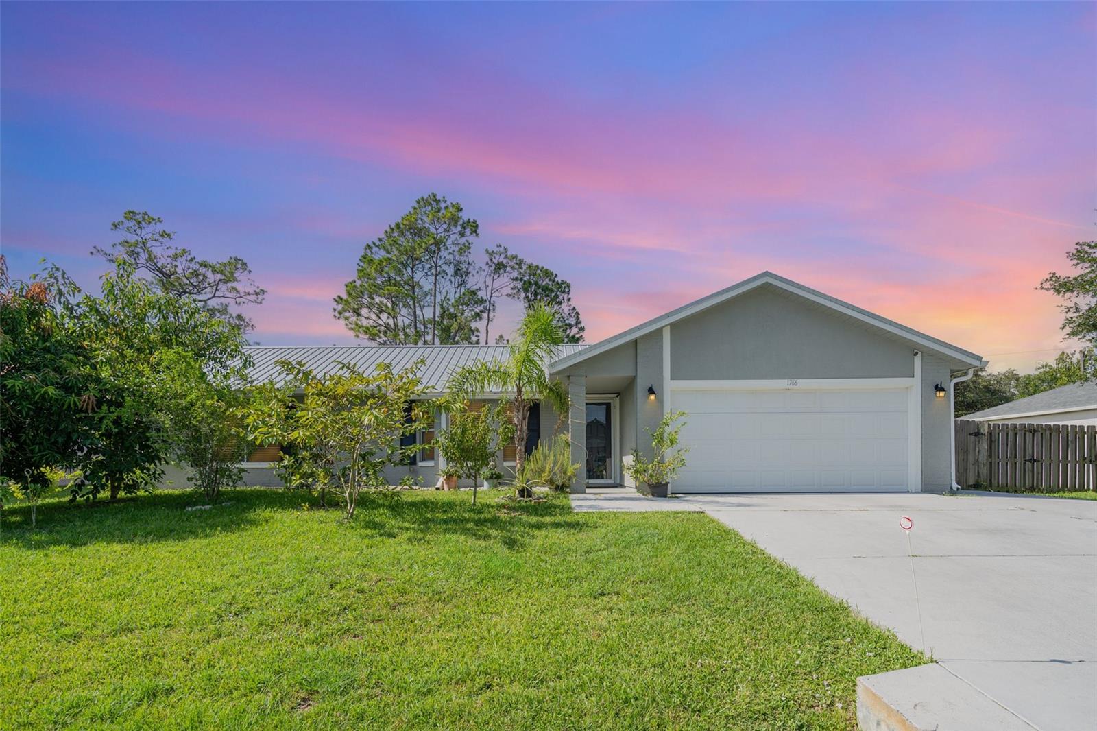 Charming 3-bedroom, 2-bath pool home in desirable NW Palm Bay, ideally situated near shopping, dining, and excellent schools. Enjoy a large fenced backyard and a screened-in pool—perfect for both entertaining and unwinding. Inside, the open layout and vaulted ceilings create a bright and airy feel. The home features numerous updates: a modern kitchen with stainless steel appliances and granite countertops, updated tile and flooring, renovated bathrooms, fresh interior paint, and popcorn ceiling removed. Water heater (2024), AC (2022).Give yourself a tour!