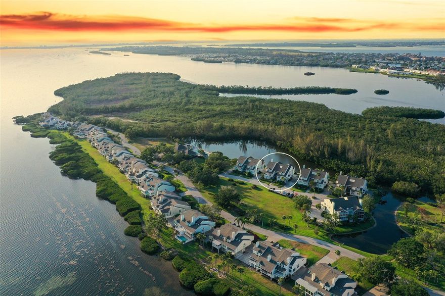 Nestled in the exclusive Tidy Island community on Florida's Gulf Coast, this stunning 2 bedroom + den/2 bath home offers a unique blend of tranquility, security, and resort-style living. With its solid build and comprehensive safety features, this property provides peace of mind for its owners. Just minutes from Anna Maria Island's pristine beaches, IMG Academy, and Sarasota’s cultural scene, Tidy Island presents itself as a hidden treasure. Explore this low-density oasis featuring sturdy waterside homes amidst 240 acres of natural beauty, including a protected bird sanctuary. You will find meticulously kept grounds, natural shorelines, and picturesque walking trails, all complemented by resort-style amenities. Inside, enjoy expansive living areas that open to a sunlit Florida room overlooking peaceful water views. The primary suite connects directly to the Florida room with a vast bedroom. The Florida room also connects to the expansive Great Room. The kitchen boasts high-end countertops, and stainless steel appliances, a breakfast nook, and a pass through to the den or second living space.  A secondary bedroom nearby offers a lovely balcony with water views. The 2 car garage has an additional spacious storage/workshop space. Spend your days relishing the many benefits of living on pet-friendly Tidy Island, including boardwalks, a private kayak launch, an Archaeology Museum, and ample opportunities for walking and biking. The all-inclusive fee covers two inviting pools, spas, pickleball and tennis courts, clubhouse, fitness center, community kitchens, meeting spaces, trails, boardwalks, community maintenance, 24-hour security guards, on-site maintenance team and property management, landscaping and grounds care, unit exterior care (with new roofs done in 2021), pest control, Wi-Fi, cable, water, trash, and shoreline preservation. Don't miss out on the unmatched lifestyle and community events in this exceptional enclave on Sarasota Bay.