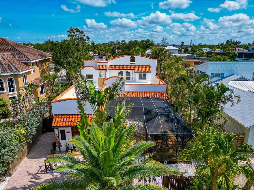 Park your Boat  behind your home .... Welcome to this boaters paradise! This recently renovated 3-bedroom, 3-bathroom home  nestled in the heart of Siesta Key. With 3,324 square feet of well designed living space, this contemporary home offers both luxury and comfort in one of Florida's most coveted locations.
Step inside to find over-sized rooms that can be utilized for entertaining or simply unwinding after a day at the beach and boating. These multi-purpose rooms adapt to your lifestyle, whether you need another bedroom, home office, fitness space, or creative art studio. A true showstopper awaits outside, where a Lucas Lagoons designed pool transforms your outdoor living area into a resort-worthy oasis. Known for creating breathtaking aquatic masterpieces, this signature pool feature turns everyday swimming into a resort setting for entertainment. Imagine hosting poolside gatherings that friends will talk about for years to come! Sun worshippers will appreciate the large rooftop tanning area—your private perch for soaking up Florida's famous sunshine while enjoying gentle Gulf breezes. It's like having your own exclusive sundeck without the crowds. This house is the perfect balance between contemporary sophistication and vacation-like comfort. Beautiful, neutral finishes throughout create an atmosphere of elegance without sacrificing that relaxed coastal vibe that makes Siesta Key special.
Location? Simply unbeatable. Situated in central Siesta Key, you're just a stroll from the bustling Siesta Key Marketplace where local shops and dining options abound. Siesta Market is less than a 10-minute walk away—perfect for picking up ingredients for an impromptu dinner or beach picnic. For those who appreciate the island's famous nightlife, Siesta Key Oyster Bar and Daiquiri Deck are within easy walking distance. Meanwhile, the world-renowned Siesta Beach—celebrated for its powder-fine white sand—is just a short bike ride from your doorstep. The primary bedroom offers a serene retreat after days filled with sunshine and adventure, while the additional bedrooms provide comfortable accommodations for family and guests. This isn't just a house—it's an invitation to embrace the laid-back yet luxurious Siesta Key lifestyle. Where morning coffee comes with water views, weekends blend into beach days, and every evening feels like a vacation. Why visit paradise when you can live there?