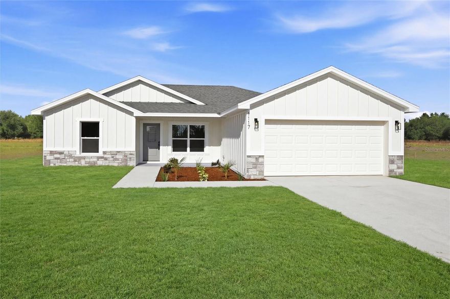 One or more photo(s) has been virtually staged. ***NEW CONSTRUCTION ON 1 ACRE! MOVE IN APRIL 2026*** Don’t miss this incredible opportunity to own a beautifully crafted home situated on a full acre with no HOA—offering the space, privacy, and flexibility you’ve been searching for. This thoughtfully designed 3-bedroom, 2-bathroom home features an open-concept layout filled with natural light, vaulted ceilings, and a seamless flow perfect for both everyday living and entertaining. The kitchen is the heart of the home, showcasing hardwood cabinetry, elegant granite countertops, stainless steel appliances, and a large center island ideal for meal prep, casual dining, or gathering with guests. The kitchen and dining area open directly to the covered back porch, creating a true indoor-outdoor living experience. Whether you’re hosting weekend barbecues or enjoying a quiet evening, the spacious front and back porches provide the perfect setting to take in both sunrise and sunset views. The primary suite is designed as a private retreat, complete with dual sinks, a walk-in shower, and an oversized walk-in closet. The split floor plan offers added privacy, with secondary bedrooms positioned on the opposite side of the home—perfect for family or guests. Set on a full acre, the property offers endless possibilities—bring your animals, boat, or recreational vehicles; add a workshop, pool, or garden, and truly make the space your own. Additional highlights include modern finishes throughout, energy-efficient features, an attached 2-car garage, and a builder’s warranty for added peace of mind. Conveniently located with easy access to shopping, dining, and major roadways, this home combines the tranquility of country-style living with everyday convenience. Schedule your private showing today and discover the perfect blend of comfort, space, and freedom.