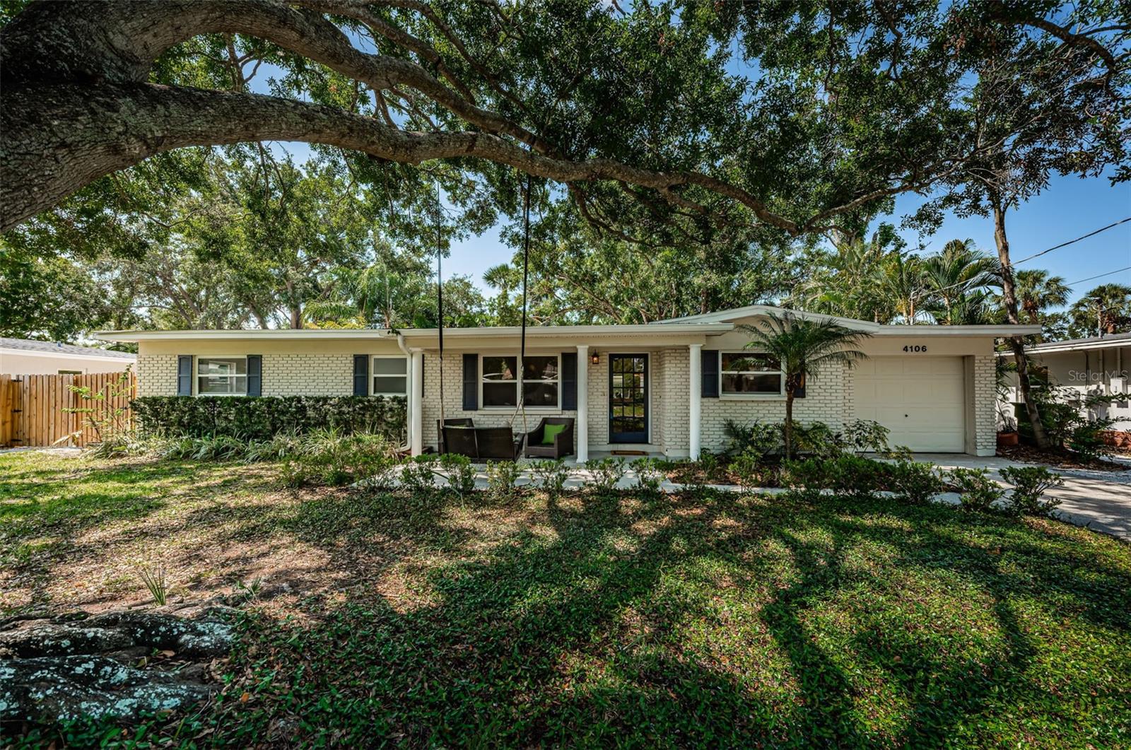 Renovated 3-Bedroom Home with Garage, Screened Lanai & Spacious Workshop. Don’t miss this beautifully renovated 3-bedroom, 2-bath home featuring a one-car garage and a large detached workshop (28’ x 12’), perfect for storage, hobbies, or future creative use. Step inside to discover a stunning new kitchen with elegant dolomite countertops, an oversized breakfast bar with ample storage, and stylish finishes throughout. The spacious living room boasts brand-new built-in entertainment cabinetry and countertop, offering both function and flair. Enjoy indoor-outdoor living with sliding glass doors that open to a large screened lanai, leading to a generous fenced backyard—ideal for entertaining, relaxing, or pets and play. The expansive primary suite includes a massive walk-in closet and a fully renovated en-suite bathroom featuring new quartz countertops and updated cabinetry. Both secondary bedrooms are comfortably sized, and the hall bathroom has also been tastefully updated. Located just one mile from the new Kenneth Adum Magnet School, and less than a mile to Publix, Walmart, and other everyday conveniences. Commuting is a breeze with easy access to the expressway, placing you minutes from downtown Tampa and St. Petersburg. This move-in-ready home offers style, space, and outstanding location—schedule your showing today!