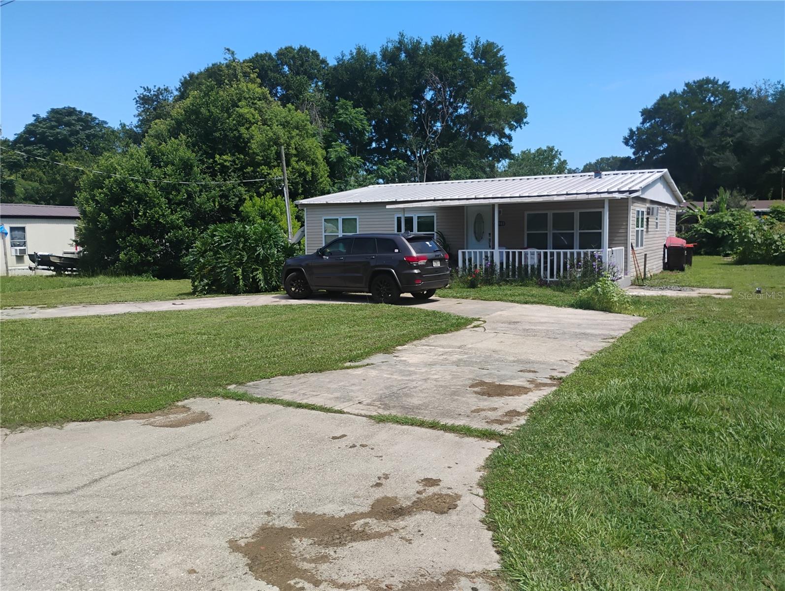 Welcome to this cozy, fully renovated mobile home in Ocklawha! Just a short drive from Belleview, Summerfield, The Villages, and Ocala. Nestled in a quiet neighborhood with a paved road providing easy access. Enjoy the spacious rooms and both front and back porches while you relax in your new home. The property has a large yard that is partially fenced and landscaped. Only minutes from Carney Island and Lake Weir. Between the modern updates and location this is a great place to make your next home. Call to schedule a showing.