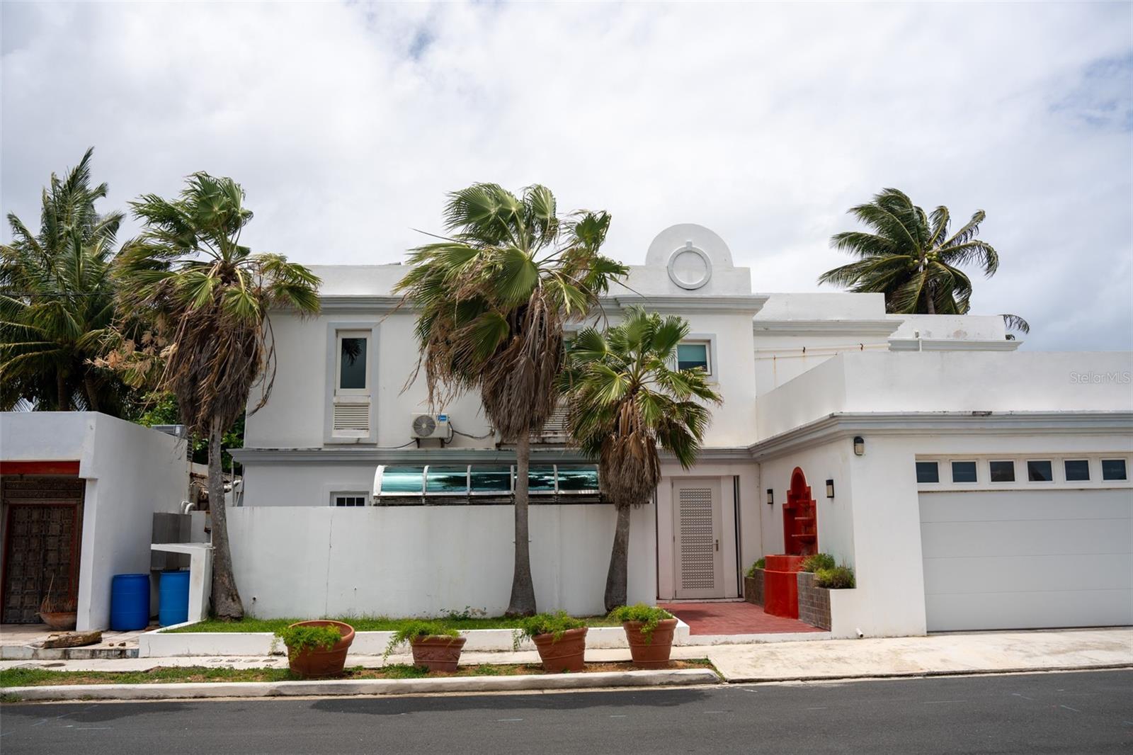 Oceanfront opportunity in Puntas Las Marías! This spacious 4,994 sq. ft. property is located in an exclusive gated community, just steps from the beach, restaurants, shops, and hotels. The property features 6 bedrooms, each with its own bathroom and balcony with ocean views, plus large terraces, a pool with jacuzzi, and a 2-car garage.The property also has a solar panel system to help reduce energy costs. It consists of two two-story apartments (Units A and B), currently used as a single home. The layout is open and bright, perfect for relaxing or entertaining. The property need repairs, but with its unbeatable location and great potential, it’s a rare find for anyone looking to invest or create their dream space by the sea.