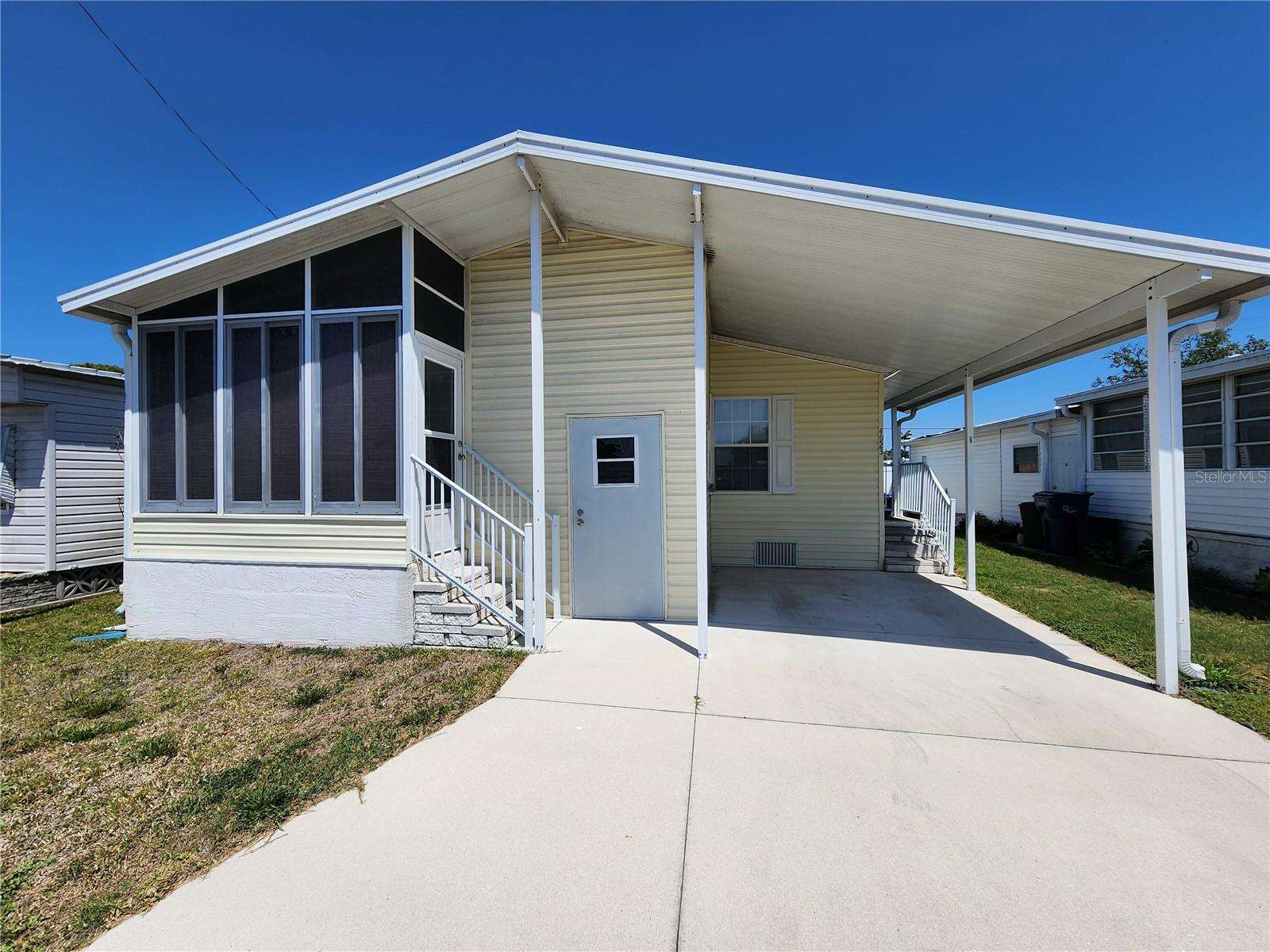 CAN YOU BELIEVE THIS PRICE??? Charming & Spacious 2-Bedroom Home! Fair Lane Acres. Non age restricted and Pet friendly. This beautifully maintained 2-bedroom, 2-bath home, built in 2005 to hurricane standards. It offers an open and spacious layout perfect for comfortable living. It had a new roof in 2021 and new A/C in 2024. The extra-large kitchen provides ample counter space and storage, while the inside laundry adds convenience. The master bath features his-and-her sinks, and additional storage is available under the unit. Enjoy the benefits of a carport, a low-maintenance fee, and NO lot rent! This all-ages, pet-friendly community includes a clubhouse, pool, and on-site manager. Conveniently located near shopping, restaurants, banks, and the airport—this home is a must-see!