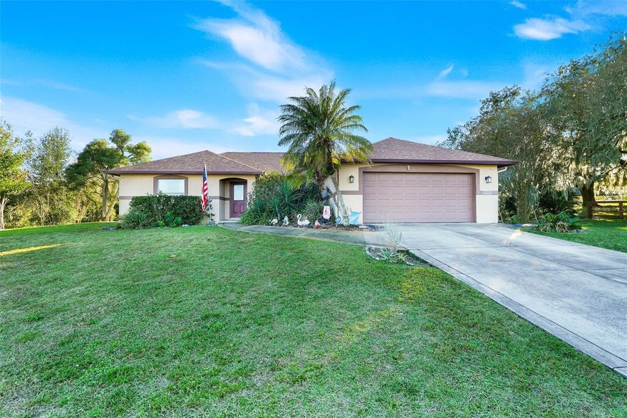 One or more photo(s) has been virtually staged. 1/2 ACRE CORNER LOT! Recently updated with a new roof (2023), water heater (2023), water softener (2022), and Central A/C (2019) Termite Tubes installed (2025) New Garage door remote opener (2020)
- Solar panels installed in 2020 WILL BE PAID OFF AT CLOSING!, your average electric bill is less than $100/month! 
This home is a great find, combining comfort, style, and quality upgrades. Don’t miss out on this incredible opportunity—schedule a showing today! This custom-built home has everything you’ve been searching for and more. As you enter, you'll be greeted by a living room featuring cathedral ceilings and an open floor plan that seamlessly connects to the dining room and kitchen. This layout is perfect for entertaining!
French doors in the dining area lead to an extra-large screened Florida room (40ft wide), designed for relaxation and entertaining. This screened in space has a custom-built bar, beautiful wood ceilings, and stone walls as well as nice roll up window shades—the highlight of the home! Whether for BBQs or large gatherings, this room is ideal. 
**Property Features:**
- ** 3 Bedrooms:**   
- ** 2 Bathrooms:**  
- **Lot Size:** Spacious 1/2 acre corner lot. Large shed in the backyard for storage! 
- No HOA—bring your boat or RV! (public boat dock just down the street)
- Ceiling fans throughout for added comfort
- Tiled showers in the bathrooms!