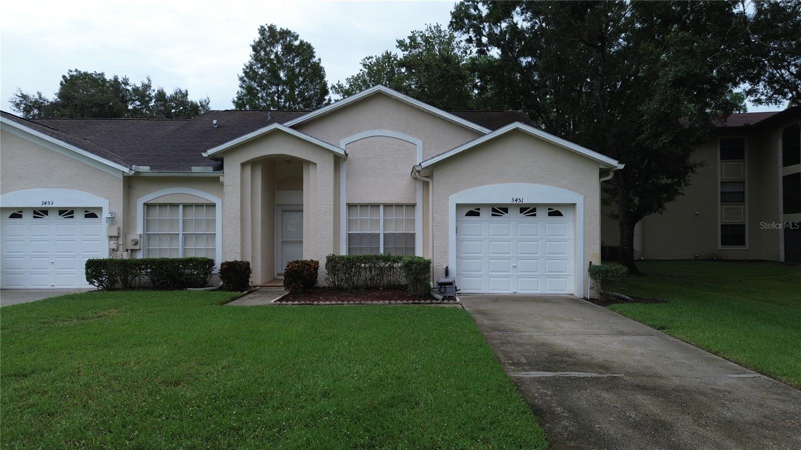 Spacious Villa in the gated community of Tealwood. This 3 bedroom home (1 currently used as a den). Enjoy peaceful views of the vast pond behind your home. Deer and Turkey have visited the backyard with an occasional otter! Inside you will find an expansive split bedroom home with bright open living spaces. The kitchen has a breakfast bar and beautiful granite counters. So much usable cooking space!! Open the sliders from the living room into the Lanai and enjoy the view! The primary bedroom has a large walk-in closet and an en-suite bathroom with dual vanities, a soaking tub, and a separate shower. Indoor laundry room in between the kitchen and garage. Long driveway allows parking for several vehicles! Nearby is the stunning John Chestnut Park YMCA, groceries, bars and restaurants, shopping and east commute to Tampa and Tampa International airport. This is a pet friendly community that allows large dogs! HOA takes care of roof maintenance and replacement as well as lawn maintenance. Tealwood amenities include a pool, clubhouse, Tennis, pickleball and basketball courts and bicycle/walking trails. Start enjoying this excellent community now!