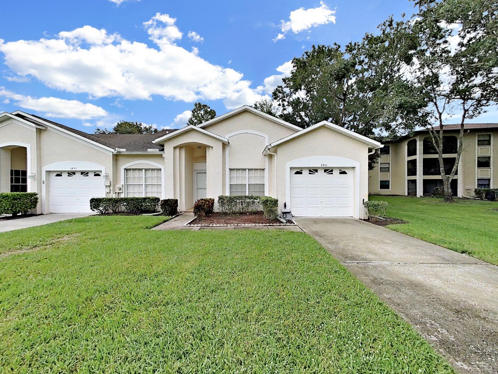 Spacious Villa in the gated community of Tealwood. This 3 bedroom home (1 currently used as a den). Enjoy peaceful views of the vast pond behind your home. Deer and Turkey have visited the backyard with an occasional otter! Inside you will find an expansive split bedroom home with bright open living spaces. The kitchen has a breakfast bar and beautiful granite counters. So much usable cooking space!! Open the sliders from the living room into the Lanai and enjoy the view! The primary bedroom has a large walk-in closet and an en-suite bathroom with dual vanities, a soaking tub, and a separate shower. Indoor laundry room in between the kitchen and garage. Long driveway allows parking for several vehicles! Nearby is the stunning John Chestnut Park YMCA, groceries, bars and restaurants, shopping and east commute to Tampa and Tampa International airport. This is a pet friendly community that allows large dogs! HOA takes care of roof maintenance and replacement as well as lawn maintenance. Tealwood amenities include a pool, clubhouse, Tennis, pickleball and basketball courts and bicycle/walking trails. Start enjoying this excellent community now!