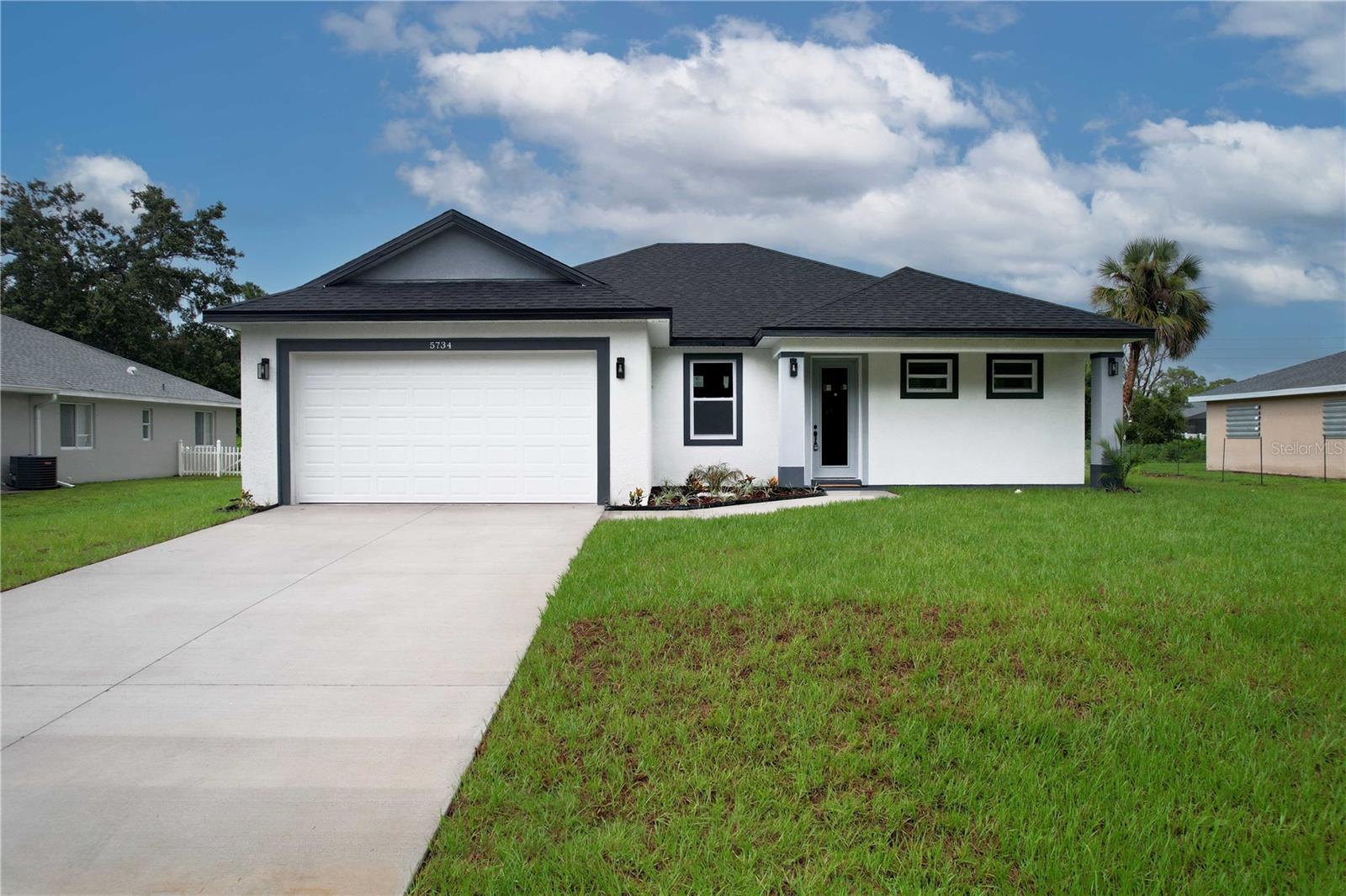MOVE IN READY! Welcome to your new home in the heart of North Port! This spacious 4-bedroom, 3-bathroom residence offers a smart and stylish layout perfect for everyday living. You’ll find durable vinyl flooring throughout the main areas and ceramic tile in the bathrooms and laundry room for added convenience. The open floor-plan features high ceilings that create a light and airy feel, and French doors lead out to a large covered lanai, ideal for relaxing or entertaining. The kitchen is thoughtfully designed with quartz countertops, 42” upper cabinets, ample cabinet space, and a functional layout that opens to the living and dining areas—great for both cooking and connection. This home also features a split-bedroom floor-plan, offering privacy for family members or guests. The 2-car garage provides secure parking and additional storage space. Situated in a growing area of North Port, this home is close to everything you need. Enjoy nearby Cocoplum Village Shops, Warm Mineral Springs, and a variety of dining and entertainment options. Outdoor enthusiasts will appreciate the proximity to Myakkahatchee Creek Environmental Park, Blue Ridge Park, and scenic trails for hiking, biking, and kayaking. Plus, you’re just a short drive from beautiful Gulf Coast beaches and the vibrant Downtown Wellen Park community. This home is also zoned for highly rated public schools, making it a great choice for families. Don’t miss this opportunity to own a modern, move-in ready home in one of Florida’s fastest-growing cities!