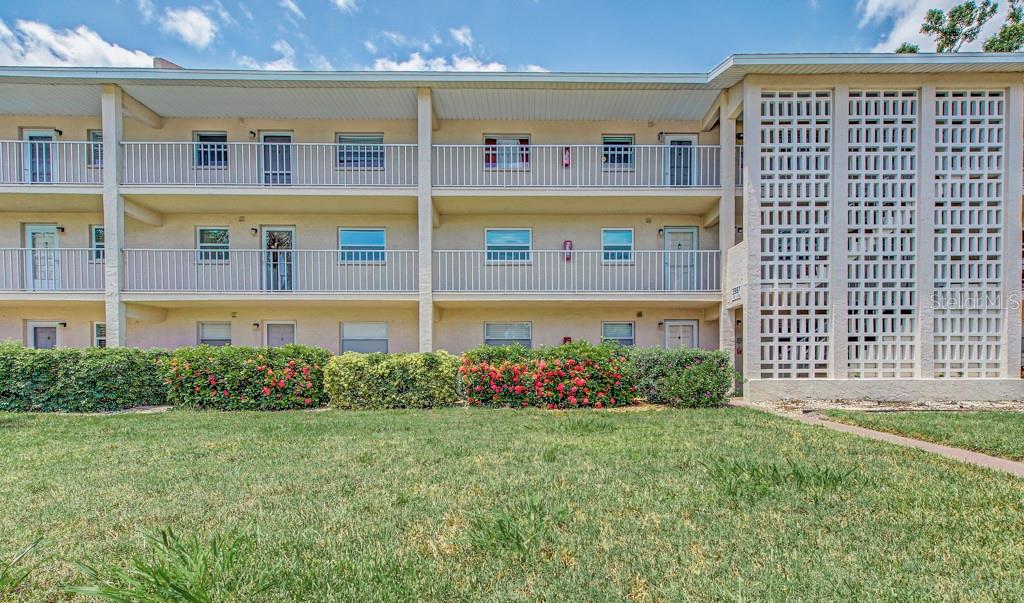 Under $200,000 in Sarasota!! Newly renovated 2/2 FURNISHED second floor condo facing the pool and greenbelt for wonderful privacy and views. Almost 1,000 square feet with new luxury vinyl flooring throughout. Quartz countertops in both baths and kitchen, new subway tile backsplash and in showers. Inerior impact windows, recessed lighting with new electrical panel, all new stainless steel appliances including Bosch stackable washer and dryer. Enjoy a tiled and glassed in peaceful lanai. Save money, there is no need to own a car. Location is walkable to public transportation, restaurant, Publix, shopping, Starbucks and more. And, it is minutes to a golf course and the beautiful beaches. All buildings have elevators, and this 55 plus friendly community boasts a beautiful swimming pool, shuffleboard, gas grills and clubhouse. HOA fees include grounds maintenance, private road and cable t.v., sewer, trash and water.