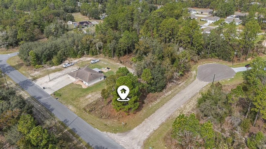 Discover the perfect opportunity to build your dream home or investment property on this 0.26-acre vacant, corner lot, nestled in a tranquil community.  Experience the charm of small-town living while being just a short drive from Tampa, nature trails, and local shops. This spacious lot is perfect for designing your custom home, with ample room for outdoor living or a garden. Conveniently located just minutes from shopping, dining, schools, and the Suncoast Parkway, you'll enjoy easy access to Tampa and the airport in under 45 minutes. Best of all, there are no HOA or CDD fees to worry about. Don’t miss your chance! Schedule your showing today and start planning your future in sunny Florida!