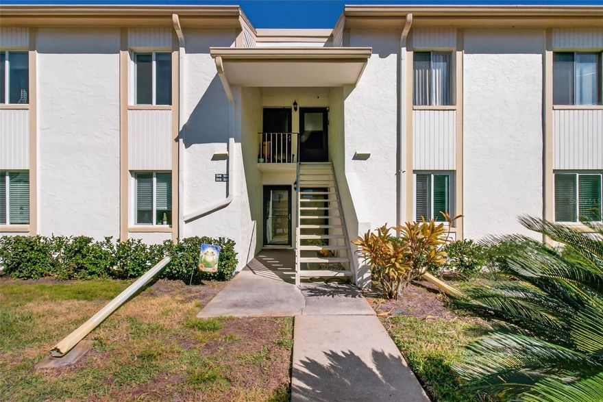 Relax and enjoy the serene views from your screened balcony/patio overlooking the natural setting with trees, wildlife and pond!  This 2 Bedroom 2 Bath condo in the gated community of East Lake Woodlands in Cypress Estates III has an open Living Room/Dining Room area offering creative options for your furniture.  The Kitchen includes a pantry closet and room for a small table and chairs.  Primary Bedroom has glass door access to the balcony, 2 walk-in closets and an ensuite private bathroom.  Laminate flooring in the Living Room, Dining Room and both Bedrooms.  Tile floors in the Kitchen and both Bathrooms.  Washer and Dryer in Balcony closet.  HVAC replaced 2021.  Assigned Covered Carport Parking Space.  Condo fees cover basic cable, water, sewer, trash and more!  Option to join Ardea (formerly East Lake Woodlands) Country Club with 2 golf courses, tennis and pickleball courts, fitness center, dining options, and more!  Shopping and restaurants nearby.