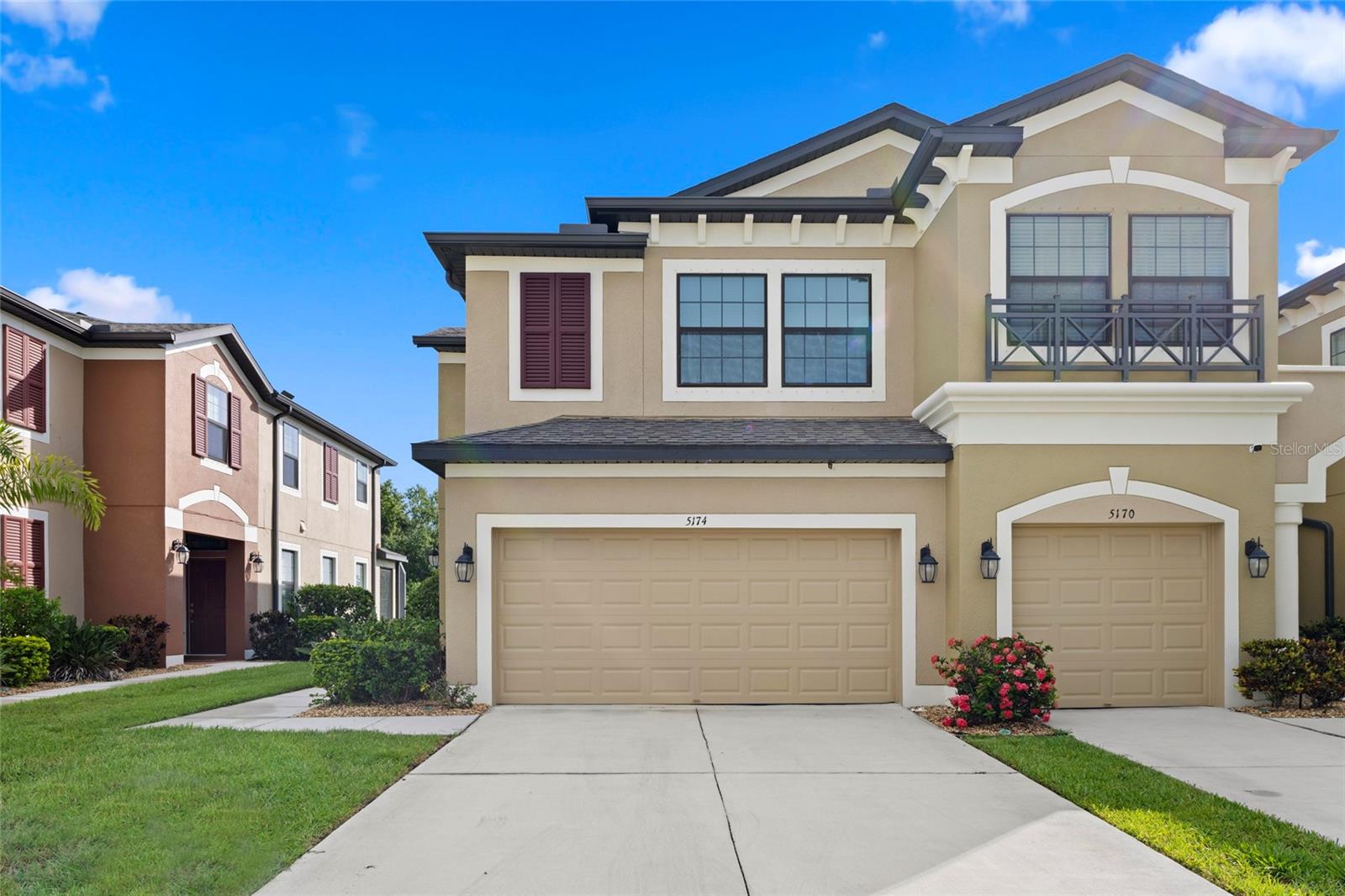 Welcome to Creekwood, the epitome of luxury living! This stunning townhome offers an impressive 2,181 square feet of beautifully designed space, complete with a breathtaking pond view and a convenient two-car garage. Step inside through the inviting side entrance and be greeted by a spacious foyer that sets the tone for the rest of the home. To your right, you'll find a chef's dream kitchen, featuring a generous island, ample counter space, and abundant cabinet storage. Just off the kitchen, you'll discover a well-appointed laundry room, a stylish half bath, and easy access to the garage, making everyday living a breeze. Beyond the kitchen, the dining area beckons to your left, while the expansive family room to the right is flooded with natural light, creating a warm and welcoming atmosphere. Slide open the glass doors from the dining room to reveal your own private extended lanai, perfect for savoring tranquil views and entertaining guests. A staircase located in the front right of the family room leads you to a fabulous bonus area upstairs. To the left, you'll find two spacious bedrooms, each boasting large walk-in closets, accompanied by a full bath conveniently located between them. On the right side of the bonus area lies your luxurious master suite—a true retreat. This stunning primary suite features an exceptionally large walk-in closet, and an elegant master bath designed for relaxation. With double sinks, a linen closet, and a spacious walk-in tiled shower, this master bath is the perfect sanctuary to unwind. Don't miss the opportunity to make this dream townhome your own—luxury and comfort await you at Creekwood!