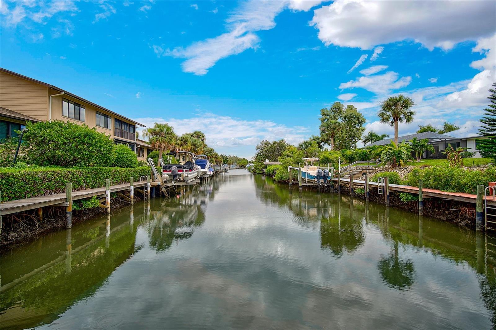 TURNKEY FURNISHED RENTAL. SHORT(4 month min) OR LONG TERM , located in a quiet gated community just across the bridge from Siesta Key. Walk or bike to the beach. This second and top floor unit spacious unit has vaulted ceilings and an open floor plan. The huge primary onsuite overlooks the canal and has a separate tub, shower, WC, 2 sinks, walkin closet. There is a king size bed and large wall mounted TV. The split bedroom floor plan offers privacy and a guest bedroom wing. There you will find 2 bedrooms, one with a king bed (has TV) ; the other a queen. Large closets in both. There is a full size bath in this wing and a full size washer/dryer. The kitchen is well stocked. Lots of counter space and cabinets and an eat-in kitchen. The living room features a huge wall mounted TV, nice size dining area and a separate sitting area with floor to ceilings sliders overlooking the canal. The 2 car garage has an automatic opener and is stocked with beach chairs. The condo is adjacent to the pool. It's only a 15 min drive to downtown Sarasota. The short term lease must be 4 months or more. Tenants pays electric and water. An annual lease is also available for $4000/mo. The $6000/mo is for Jan-April. Add'l months would be $4000/mo. Cable/TV/internet is included in rent. A dock w/ lift is available for an add'l cost. Renters can have a pet if they provide documents that it is a service animal or an emotional support pet.