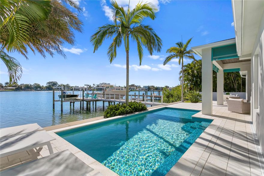 Welcome to the Causeway Isles — the true boaters paradise of St. Pete! Moments away from the Gulf of Mexico, this **2016 FULLY RENOVATED** 3 bedroom, 3 bathroom impressively designed, contemporary Key West home depicts perfect Florida-living. With top of the line dock craftsmanship and lifetime decking, brand new seawall & bulk head -- the dual 10,000 and 15,000 lb boat lifts allow for you to choose the waterfront adventure for the day. Cruise around on the calm intracoastal waterways and make pit stops at the local restaurants and islands or jump on the center console and head off shore to catch dinner for the night! As you clean the boat, watch the breathtaking sunset views from the Southwest facing dock, pool, and lanai. Chef up the days catch on the custom outdoor kitchen after taking a dip in the salt water, pebble tech pool with plenty of seating for the crew. Inside the home, you’ll feel the soothing outdoor atmosphere meet the calming customizations wash over you. Overlooking the plush main living area with faux wood beams and built in surround sound speakers, the chefs kitchen with custom wood cabinets & range hood accessorizing the oversize WOLF gas range, built-in WOLF refrigerator & WOLF wall mounted combo microwave/oven — the laminated edge waterfall leathered marble countertop look like pages from a magazine. With space for bar seating and built in banquet dining area (with extra storage), entertaining here is a dream! Truly no detail was left unfinished in this custom home. The master suite, flooded with natural light overlooking the intracoastal basin with custom inlay ceilings, motorized shades, spectacular custom closet complete with thoughtful storage options for the most elaborate of wardrobes (and a secret laundry chute!) The master bath is complete with private water closet, separate custom wood vanities, double walk-in shower with dual shower heads and benches. Two additional bedrooms share a well designed jack-and-jill bathroom. The third bathroom doubles as a guest bath with charming glass tile, tub/shower combo and embellished lighting sconces. Heavy inch and a half thick solid wood doors add additional privacy and sound proofing throughout the home along with accentuated millwork and built-ins. Porcelain wood-look tile flows the entire home accompanied by level 5 drywall, high ceilings, PGT impact-rated casement windows and all the necessities of the perfect home.
