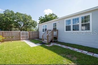Welcome to your new home! This stunning 3- bedroom,2- bath residence,built in 2022,is situated on a desirable corner lot in unincorporated Pinellas County. Where you own the land with NO HOA fees,No LOT fees and No FLOOD ZONE. This home features an open concept design that creates a spacious and inviting atmosphere,enhanced by high ceiling and large windows that fill the spaces with natural light. The split floor plan offers privacy,with a spacious primary bedroom complete with a large ensuite bath on one side,and two additional bedrooms with walk-in closets on the other. The modern kitchen has an island,stainless steel appliances and luxury vinyl flooring that extends throughout the home. An inside laundry room adds convenience,while the fully fenced backyard offers a blank canvas for your landscaping ideas,along with a shed for extra storage. A second wide gate provides secure parking for your RV,boat or other toys. Located for an easy commute to Tampa International Airport and just minutes from shopping,beautiful beaches,downtown St. Petersburg,golf course,equestrian facilities and trail. Don't miss out on the incredible opportunity to own a modern,well-appointed home in a prime location. Schedule your showing today!