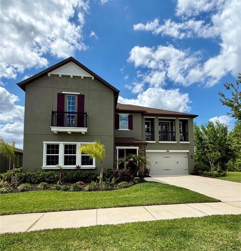 Photo of 1879 Whitewillow Drive, Wesley Chapel, FL 33543 (MLS # O6399021)