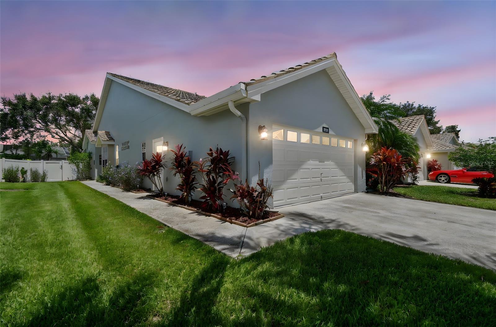 One or more photo(s) has been virtually staged. Welcome to this beautifully maintained 3-bedroom, 2.5-bath villa located in the desirable gated community of Boot Ranch – Eagle Watch in Palm Harbor. This spacious home features a bright, open layout with modern updates, including a 2024 AC system, 2023 Water Heater, Tesla charger installed in 2023, appliances, vanities, lights, toilets, flooring, garage floor tiles were all done in 2020. Step outside to your private screened lanai with charming brick pavers and a fully fenced backyard—perfect for outdoor dining and relaxation. Enjoy the peace of mind and lifestyle offered by this secure, well-kept community, complete with amenities such as a sparkling pool and tennis courts. Ideally situated near some of the area’s best parks, renowned Gulf beaches, local restaurants, and scenic biking and hiking trails, this home also offers easy access to Tampa for commuting or day trips. Whether you're looking to settle down or simply enjoy Florida living at its finest, this villa is a must-see.