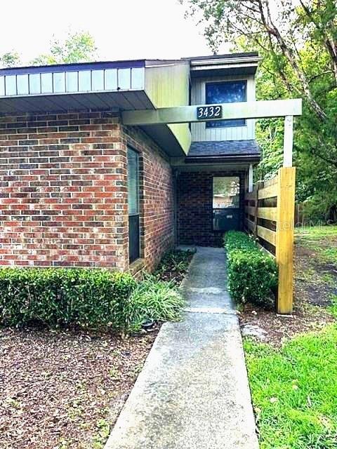 Under contract-accepting backup offers. Looking for affordability in a great location, this is it! 2 Bedroom, 2 bath end unit in Timberway located on the common area offers a beautifully maintained unit ready for your personal touch. Located on the last street in the back of the complex, this quiet location is walking distance from restaurants and shops at Timber Village and Magnolia Park Plaza on NW 39th Avenue. Timberway is a single family attached complex, not a condo. Enter the unit to a foyer area that leads to a large two story Great Room with Dining area adjacent to the open Kitchen. The Great Room leads to a screen lanai through glass sliding doors. The Kitchen overlooks the Dining area and features wood cabinets, 2022 range, refrigerator, and dishwasher, along with a spacious pantry. The large owner's suite is upstairs and features 2 closets, tub bath, plus a large adjacent bonus room which makes for a perfect office, exercise room or flex area. Downstairs is the Guest Room with hall bath. The large screened porch opens to the laundry closet which includes the washer and dryer. Off the lanai is a large deck overlooking a private yard and the common area to the side. Two dedicated parking spots are in front of the unit. The complex also features a dog park with covered pavilion. With a reasonable HOA fee that covers the roof, landscaping, and outside maintenance, a great location close to Santa Fe Community College, I-75, UF, shopping, and restaurants, this unit offers it all.