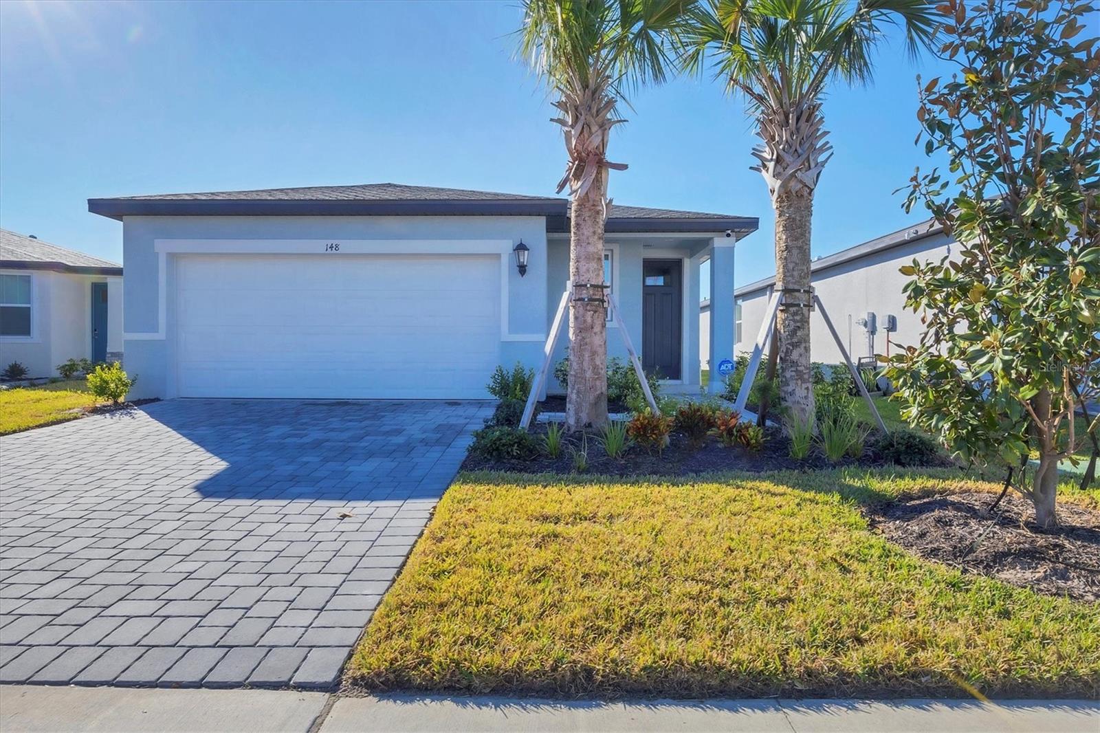 One or more photo(s) has been virtually staged. Short Sale. Don’t Miss This Value! SHORT SALE OPPORTUNITY – New 2024 Home! Energy-Efficient with LOW HOA Fees and Close to the Beach!
Why wait to build when you can own this new 2024 home that’s been lived in for only a few weeks? Set on one of the premier lots in Magnolia Bay South, this Everglade floorplan offers 3 bedrooms, 2 bathrooms, and a 2-car garage across 1,483 sq. ft. of modern living.
Inside, the open-concept design is filled with natural light and showcases partial water views from the back of the home. The stylish kitchen boasts granite countertops, stainless steel appliances, and a spacious pantry, while flowing seamlessly into the great room and dining nook. Step outside to a covered patio with plenty of room for a future pool—perfect for entertaining or relaxing.
The primary suite provides a private retreat with water views, a walk-in shower, dual vanities, and a generous walk-in closet. Two additional bedrooms offer flexibility for guests, an office, or hobbies.
Additional features include a brand-new ADT security system (ready for reconnection), durable finishes, energy-efficient construction, and a location in a non-flood zone.
Magnolia Bay South keeps living easy with low HOA fees and future resort-style amenities, including a clubhouse, pool, fitness center, dog park, playground, and sports courts. Conveniently close to I-75, you’re minutes from Sarasota, Venice, and Florida’s award-winning Gulf Coast beaches.
This is a rare chance to own a nearly new home at an incredible price—schedule your showing today before it’s gone!