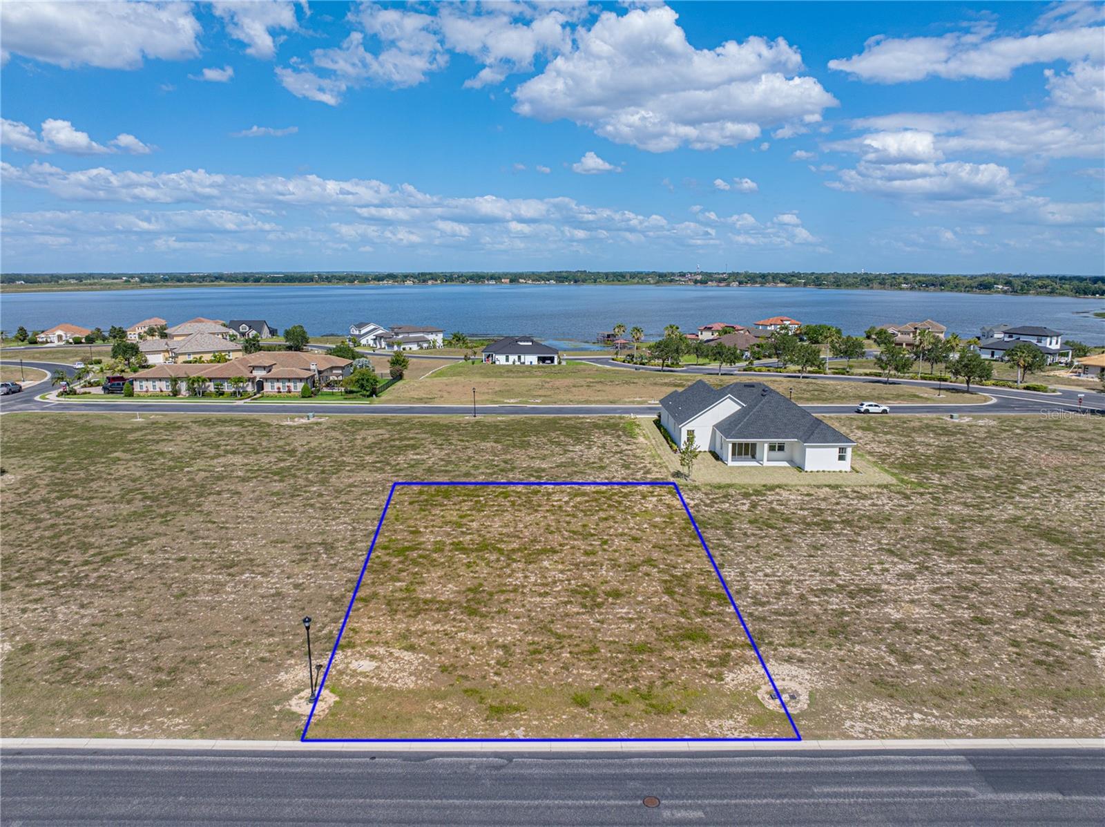 WATER RIDGE--A GATED LAKERONT COMMUNITY. This lot in the upscale neighborhood is located close to the Lake Alfred side gate. The community has access to three lakes--Lake Alfred, Lake Medora and Lake Van. There are lots of amenities--pools, fishing docks, tennis and pickleball courts, boat ramps, gym, RV and boat storage and a gorgeous clubhouse. The community is positioned between Orlando and Tampa and close to all that Central Florida has to offer. Come build your dream home.