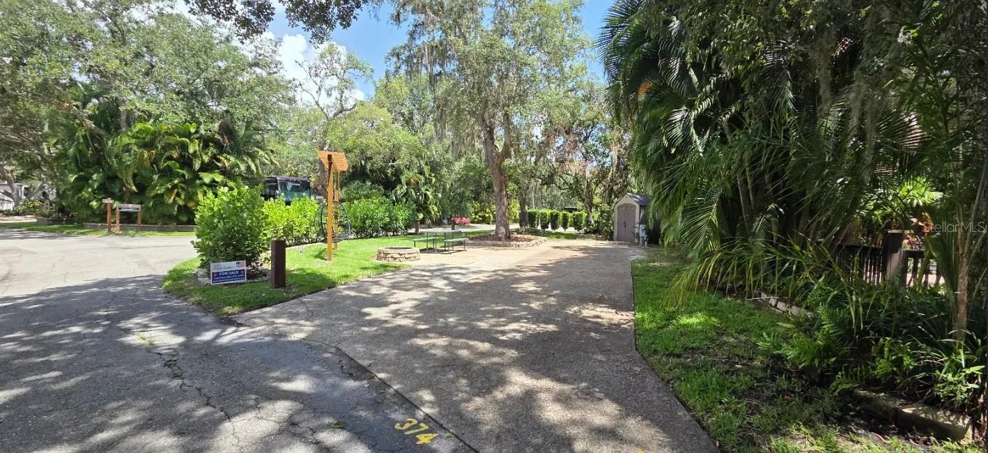 Buy an RV Lot in Central FL! WELCOME TO RIVER RANCH, Florida’s Luxury RV Resort with access to Lake Kissimmee! This RV Lot offers the perfect mix of sun & shade and is ideal for weekend escapes, snowbird season, or vacation fun in the Florida sun! Situated on a Large Corner, this RV Lot offers privacy on ALL sides! The service side of the RV is fully private with lush landscaping, the front living side offers a firepit, a pergola with hanging swing chairs, a picnic table, a shed and a nice size newly sodded grassy area! There are hedges surrounding the Lot which provide amazing privacy! BONUS: There is a separate vehicle parking space! No need to crowd your RV with cars and golf carts! They have their own space! Another BONUS: steps to laundry, bathhouse, pool and pickleball! The location on this lot is excellent and Phase 3 is highly desirable! These RV Lots are fee-simple ownership and are Deeded Lots which means NO lot rent, you own the land!
Looking for entertain and fun? River Ranch offers it here!! For starters, there is a LIVE Rodeo every Saturday night – an excellent display of showmanship and fun for the entire family! There is even a Saloon (family friendly), with LIVE bands, DJs, dance parties and they give line dancing lessons for free. Enjoy the NEW Waterpark with slides, splash pad, pool, cabanas, food, bar and more! There is an adventure park which has a bounce house, mechanical bull, climbing tower, Arcade, mini golf, outside movie on the greens, bicycle rentals, airboat rides, river boat rides, swamp buggy, hayrides, petting farm, trap & skeet range and a bow target for shooting. There are several places to eat on property. The River Ranch Chop House serving delicious food and drinks, a waterfront Smokehouse Grill serving delicious BBQ, a pizza shop and an ice cream and coffee shop (serving Starbucks.) There is also a General store and a Western store to grab all of your favorite Cowboy/Cowgirl finds! Watch the Bison, Steers, Horses and other wildlife! Don’t forget to check out the Petting Farm!!