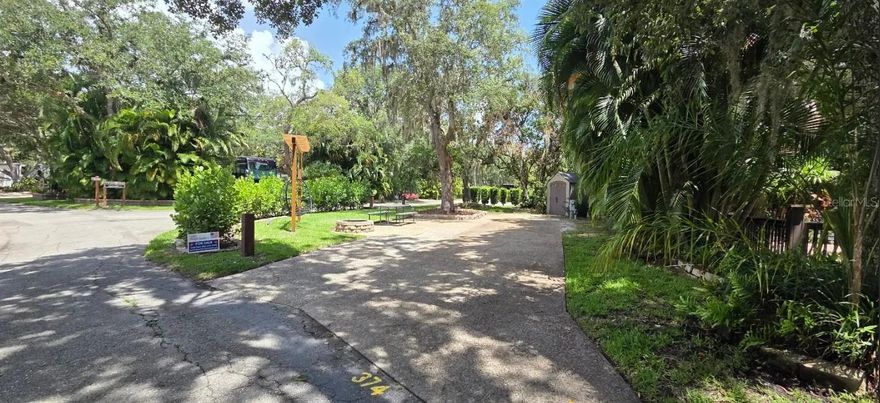 Buy an RV Lot in Central FL!  WELCOME TO RIVER RANCH, Florida’s Luxury RV Resort with access to Lake Kissimmee!  This RV Lot offers the perfect mix of sun & shade and is ideal for weekend escapes, snowbird season, or vacation fun in the Florida sun!  Situated on a Large Corner, this RV Lot offers privacy on ALL sides!   The service side of the RV is fully private with lush landscaping, the front living side offers a firepit, a pergola with hanging swing chairs, a picnic table, a shed and a nice size newly sodded grassy area!  There are hedges surrounding the Lot which provide amazing privacy!  BONUS:  There is a separate vehicle parking space!  No need to crowd your RV with cars and golf carts!  They have their own space!  Another BONUS:  steps to laundry, bathhouse, pool and pickleball!  The location on this lot is excellent and Phase 3 is highly desirable!  These RV Lots are fee-simple ownership and are Deeded Lots which means NO lot rent, you own the land!  
Looking for entertain and fun? River Ranch offers it here!! For starters, there is a LIVE Rodeo every Saturday night – an excellent display of showmanship and fun for the entire family! There is even a Saloon (family friendly), with LIVE bands, DJs, dance parties and they give line dancing lessons for free.  Enjoy the NEW Waterpark with slides, splash pad, pool, cabanas, food, bar and more!  There is an adventure park which has a bounce house, mechanical bull, climbing tower, Arcade, mini golf, outside movie on the greens, bicycle rentals, airboat rides, river boat rides, swamp buggy, hayrides, petting farm, trap & skeet range and a bow target for shooting. There are several places to eat on property. The River Ranch Chop House serving delicious food and drinks, a waterfront Smokehouse Grill serving delicious BBQ, a pizza shop and an ice cream and coffee shop (serving Starbucks.) There is also a General store and a Western store to grab all of your favorite Cowboy/Cowgirl finds! Watch the Bison, Steers, Horses and other wildlife! Don’t forget to check out the Petting Farm!!