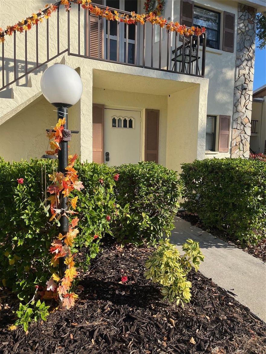 1st floor 2 bedroom/2 bath end unit in Morton Village is ready for you to make it your new Florida home!  Stay cool in this condo with a new AC installed 6/2025!!!!  This 55+ condo has lots of storage, with numerous interior closets, and large storage areas off the Florida room.  Kitchen area has bar seating with plenty of counterspace for preparing meals.  Dining/living room combo is open and welcoming.  2nd bedroom is being used as office, but has plenty of room for king size bed, for guests or couple that prefer their own space.  This condo comes turn-key furnished - bring your suitcase and move right in!!!  Morton Village has two pools (one heated and one not heated), a shuffleboard court and an active clubhouse with numerous social activities.  Close to shopping, restaurants and two local golf courses.  Area beaches are just a short drive today.  Call today to get this remarkable condo for a great price!!!