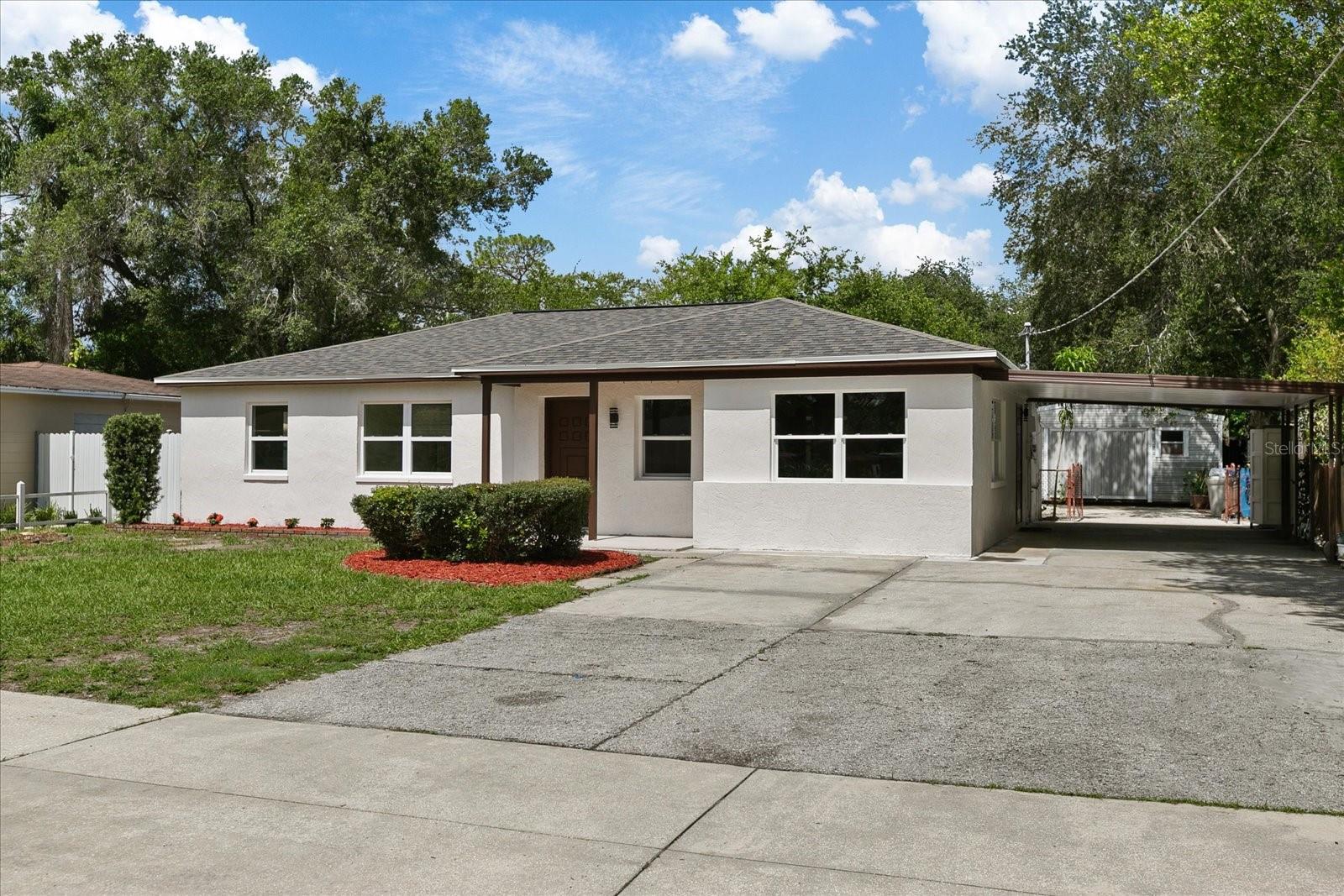 Beautiful newly remodeled property in the heart of Forest Hills Tampa, designed with an open and modern concept has 3 bedrooms and two beautiful bathrooms, modern kitchen with granite top counters and stainless steel appliances, comfortable and independent laundry room, large living room with wood veneer walls that give a unique touch to the property, air conditioning and roof newly installed in June 2024, it has two large terraces, a large patio with two storage rooms, it is located a few minutes from the golf course, restaurants, Bush Garden Park, Hospitals and more. Not HOA or CDD, Do not miss the opportunity to buy this beautiful property for your family, bring an offer!!!
