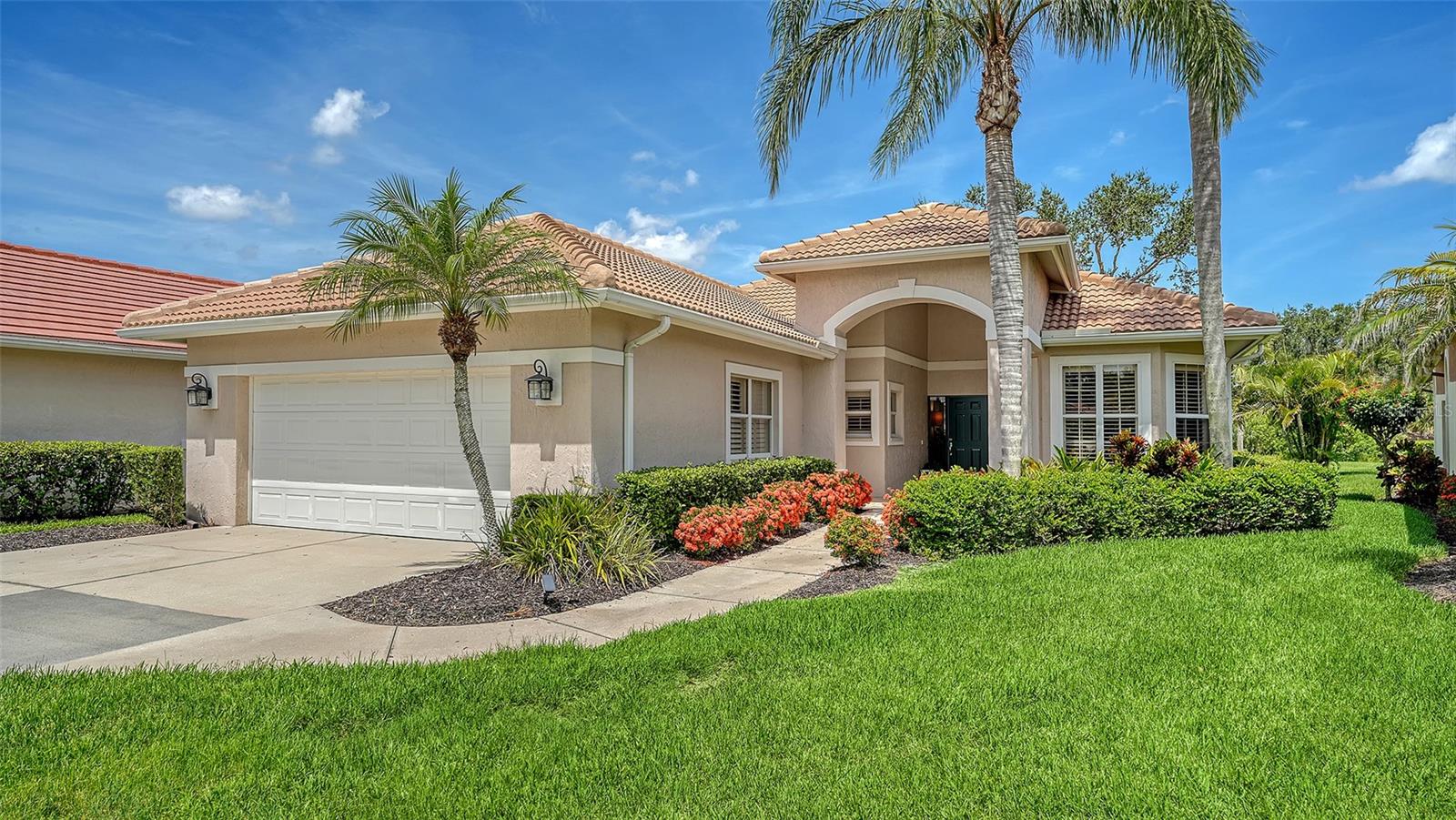 Welcome to effortless elegance in the heart of Laurel Oak, one of Sarasota's most sought after gated golf communities. This beautifully remodeled 3 bedroom 2 bath home offers 2110 square feet of refined indoor living space, along with an oversized lanai, and large two car garage- all designed with sophisticated style and low maintenance luxury in mind. Perfectly positioned on the #3 tee box of the Jones course, this home enjoys panoramic golf course views by day and captivating sunsets by night. Every inch has been thoughtfully upgraded to satisfy the most discerning buyer, with premium vinyl plank flooring, extensive built-in features, and a transitional contemporary design that blends comfort and style. The primary suite is a true retreat, with expansive sliders that frame the lush fairway views and flood the room with natural light. The custom walk in closet includes built in drawers and generous hanging space, while the spa-like ensuite bath features a large glass shower, soaking tub, and dual vanities. The heart of the home is the open concept kitchen and living area, where a large center island, custom cabinetry and a propane gas range elevate everyday living and entertaining. Whether you are hosting guests or enjoying a quiet evening at home, the sweeping golf course views are always front and center. Two additional bedrooms-each with their own distinctive character-offer flexibility for family, guests, or office space. The third bedroom is currently set up as a den, complete with a murphy bed and closet for added functionality. Located in a maintenance free enclave of Laurel Oak, lawn and landscape are included allowing more time to enjoy the amenities such as two championship golf courses, tennis and pickle ball, a resort style pool and an elegant clubhouse with dining. While golf membership is currently waitlisted, purchasing a home within the community gives you priority access at the top of the list-a unique benefit for new homeowners. Move-in ready and impeccably finished, this home is a rare opportunity to enjoy Sarasota living in a prestigious, amenity rich setting.