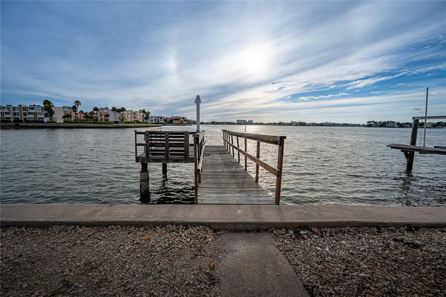 "Location, location, location!"—the golden rule of real estate, and this home delivers in every way. Nestled on the open waters of Boca Ciega Bay, this 2-bedroom, 2-bathroom gem is your front-row seat to stunning Gulf sunsets every evening. Imagine unwinding in your backyard with your favorite drink as the sky transforms into a masterpiece of colors.

The possibilities here are endless. With a generously sized backyard, there's room to add a pool or expand the existing deep-water dock to suit your boating dreams. Plus, the home itself offers ample opportunity for expansion, allowing you to create the waterfront retreat you've always envisioned.

Convenience meets paradise in this location. You're just minutes from vibrant stores, fantastic restaurants, and world-class beaches. Need to travel? Tampa International Airport is only 30-45 minutes away, and Downtown St. Pete is a quick 20-minute drive.

Don't miss your chance to embrace the waterfront lifestyle and make this home your own slice of paradise. Schedule your private tour today and start imagining the possibilities!
