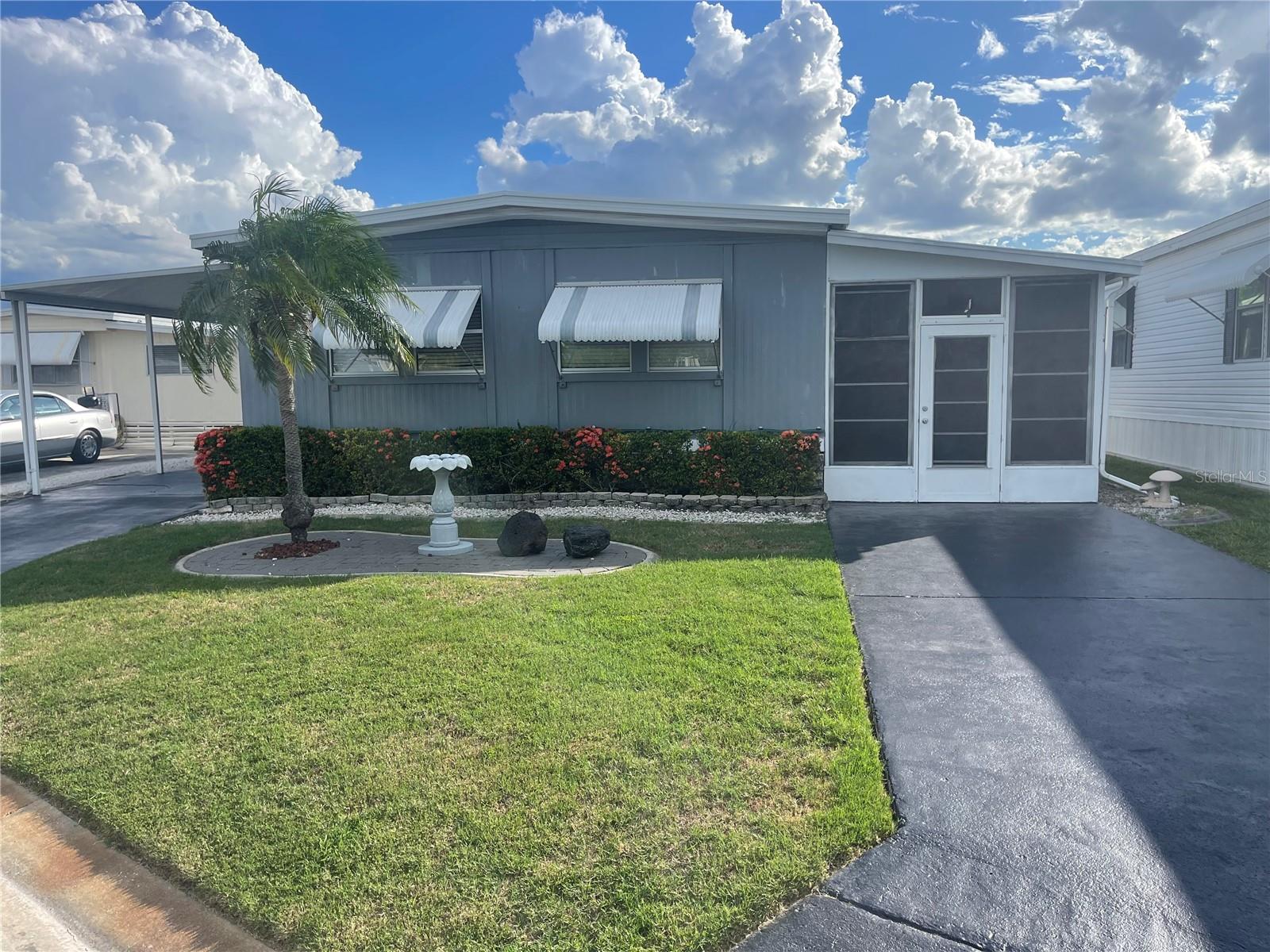 Welcome to Caribbean Isles Residential Cooperative. This home is a 3 bedroom, 2 bath home. Very Nice Kitchen with Island Cooktop. The Primary Bedroom has a large Walk-in Closet with an Ensuite. One Bedroom has been converted to an office. Great Screened Patio to just sit and watch the world go by. The home is low maintenance and well-maintained. Caribbean Isles Residential Cooperative is a highly desired community to live in. It is a VERY Active 55+ community. From Shuffleboard and Bocce Ball to Corn Hole and Horseshoes. We welcome Golf Carts and several times a year we gather and decorate for Parades. The Clubhouse is used for Dances, Games, Dinners and more. In the Clubhouse we have a well-stocked Library and a large Craft Room. The Game Room has 3 Billiard Tables, 2 Poker Tables, a Bar Shuffleboard with 2 Dart Boards. Don't miss this opportunity.