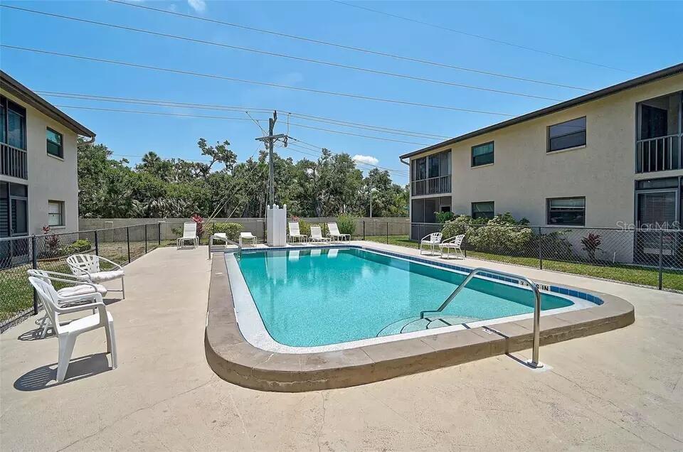 Buy a 2 bedroom 2 bath condo for the price of a recently sold one bedroom 1 bath in this complex. The condominium is sold " as is. " and is well below market price for this area. Some of the photos are possibilities for future renovations. Seller is motivated. Welcome to this charming condominium located at 7227 Cloister Dr, Sarasota, FL. This well-maintained home features 2 spacious bedrooms and 2 bathrooms, offering comfortable living spaces. The open floor plan includes a bright living area and a modern kitchen with ample storage. Enjoy the tranquil surroundings from your private patio. The community offers amenities such as a pool and clubhouse. Conveniently located near shopping, dining, and beautiful beaches, this property is a must-see!