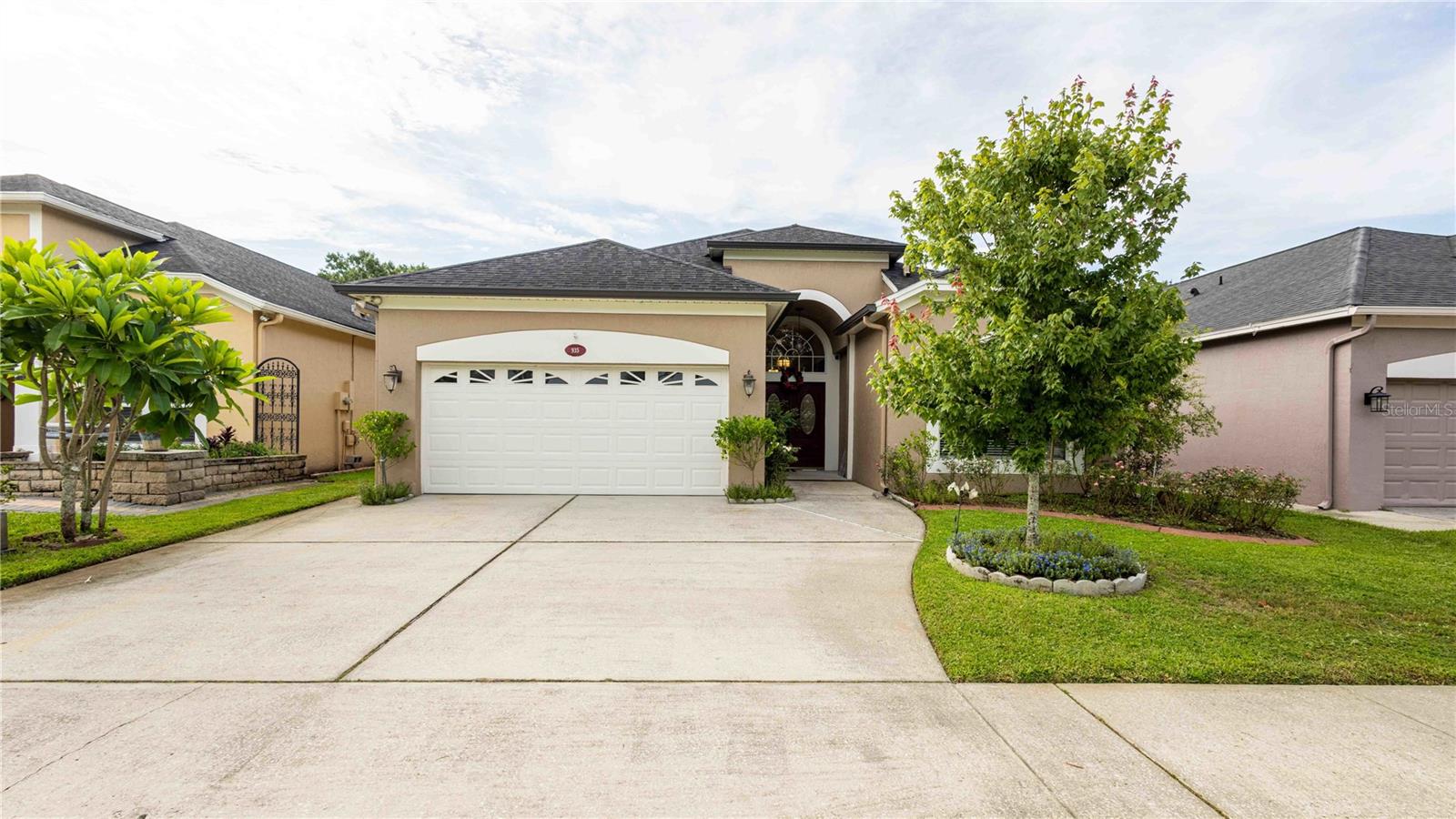 Welcome to 935 Ekana Green Ct, a spacious and beautifully maintained home located in the gated community of Ekana Green. Offering over 2,300 square feet of living space, this 3-bedroom, 2.5-bath home with a separate office or den is perfectly positioned on a quiet cul-de-sac with peaceful pond, conservation, and golf course views. Inside, the open floor plan is enhanced by soaring 12-foot ceilings, crown molding, and tile flooring throughout the main living areas. The gourmet kitchen, updated with granite countertops, 42-inch cabinets, and stainless steel appliances, features a bright breakfast nook ideal for morning coffee. The oversized primary suite includes a cozy sitting area, high ceilings, and generous closet space. The additional bedrooms and office offer wood laminate flooring—no carpet anywhere in the home. Step outside to an expansive 40’ x 40’ screened lanai with a private storage room, perfect for relaxing or entertaining. Upgrades include a water softener system, new gutters, an interior/exterior speaker system, and a full alarm system for added peace of mind. Residents enjoy access to tennis courts and golf, and the home is zoned for top-rated schools, with convenient proximity to shopping, dining, and major highways. This move-in ready home offers comfort, space, and scenic views—don't miss your opportunity to make it yours.