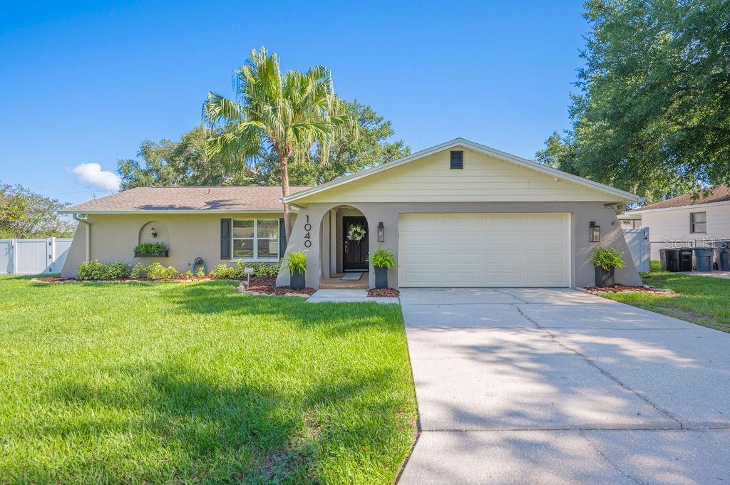 One or more photo(s) has been virtually staged. Welcome to 1040 Shadowbrook Dr N, Lakeland, FL 33813 – where charm meets modern living! This stunning home is nestled in a desirable, south Lakeland neighborhood, offering a perfect blend of tranquility and modern convenience. Step inside and be greeted by an inviting open floor plan, ideal for entertaining or enjoying family fun. The kitchen is charming and well appointed, featuring granite counter tops, 100 yr old barn wood pipe shelving & Large pantry , stainless appliances, and ample cabinet space. Relax in the spacious living room thats flows seamlessly into many of the homes other social spaces. The dining room is very large, and exits out to an amazing backyard oasis. Next ,the spacious master suite features a lovely en-suite spa-like bathroom with designer finishes. Additionally, there are 2 more bedrooms that are generously sized and perfect for guests, or a growing family.The guest bathroom is very large and has been meticulously renovated as well.This lovely home is situated on .45 acre with a fully fenced private backyard , complete with a screened rear patio perfect for grilling, beautifully landscaped, and plenty of space for family, fun and pets. The home is located minutes from wonderful restaurants, shopping, great schools, dog parks & Loyce Harpe/Carter Rd park. Roof 2018,AC-2019 , garage door 2023, water heater 2021