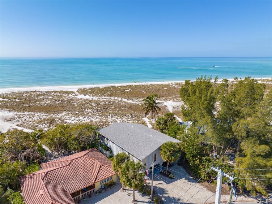 GULF FRONT ALERT!!! Can you imagine your backyard being gorgeous white sandy beaches? Here you have just that and more! The perfect “Old Florida” style home with panoramic views of the Gulf of Mexico! Enjoy sunsets every night on your oversized balcony or take a short stroll to Bean Point! It does not get any better than this. Located on the sought-after North Shore Drive on the North end of Anna Maria Island, you are both on a quiet street and also close to Pine Avenue with lots of restaurants and boutiques. This house is a 3 bedroom, 2 bathroom elevated home with tons of downstairs storage, carport and driveway for extra parking. Wood like vinyl throughout the home for easy sand clean up. The open floor plan provides beach viewing from every angle and window in the home. Watch sunset and dine on your large balcony, perfect for entertaining. Also perfect for morning coffee and the gulf breezes. Put your own personal touches on this home or build your own dream home on this incredible location.