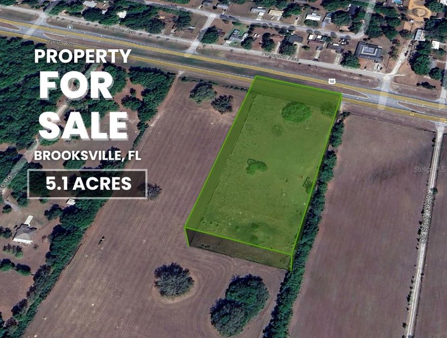 Rare 5.1-acre fenced parcel with Public Utilities and Electricity available, located directly on Cortez Blvd (SR-50) in Brooksville and Not in a Flood Zone. Zoned AG, this property allows a Single-family, Mobile, Modular, or Manufactured home, plus accessory structures such as barns, workshops, garages, and equipment storage buildings (per county setbacks). Horses, livestock, crops, and agricultural use are permitted, making it ideal for a private residence, a Hobby Farm, an Equestrian property, or an Income-producing Agricultural venture. No HOA or CDD, giving you full control of the land for your plans and long-term goals. Prime location with excellent exposure on a major corridor near I-75, US-301, and the Suncoast Parkway, offering strong potential for future appreciation or development. Centrally located just 45 minutes to Tampa, 1 hour to Orlando, and 1 hour to Ocala. Financing available with as little as 20% down for qualified buyers.