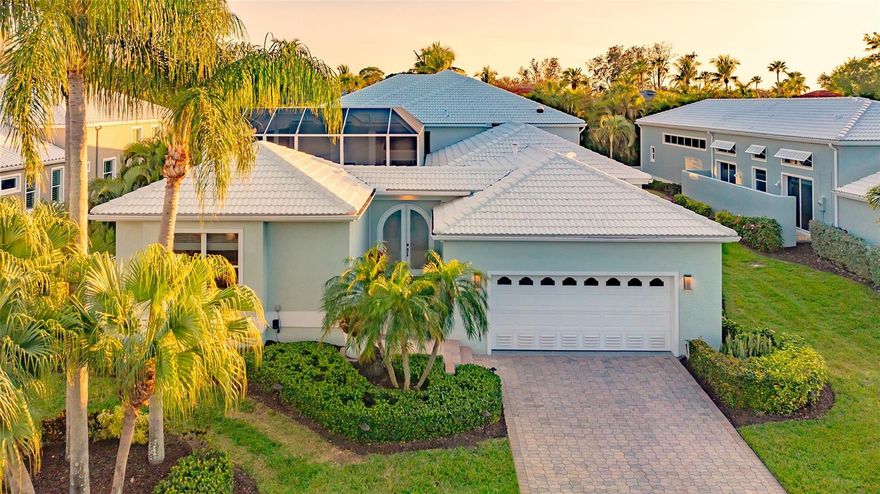 Welcome to Corey's Landing, a coveted enclave of 64 single-family homes on the Bayfront in the highly desired mid-key location of Longboat Key.  This timelessly elegant updated four-bedroom, three and one-half bathroom home is being SOLD TURN-KEY FURNISHED and is located directly across the street from the Bay.  The open floorplan is bright, light and the neutral updates and features are sophisticated and luxurious curating a feeling of an exquisite coastal lifestyle. The main home features an inviting concept with high soaring ceilings flowing into the glass Florida Room overlooking abundant vegetation in back.  The updated kitchen is a gourmet space that overlooks the dining room/great room and features granite countertops, an expansive peninsula, and top-of-the-line brand new (2024) Cafe stainless-steel appliances (new refrigerator being delivered soon). Indulge in the large great room, complete with a cozy fireplace and walls of sliders.   The primary suite on the main floor has recently been updated with a serene spa like bathroom.  With his and her walk-in closets, en-suite bathroom, it's a tranquil haven where you can unwind in privacy after a day at the beach. The additional bedrooms and updated bathrooms are located at the other side of the home allowing additional privacy for family and guests.  The casita features a fourth bedroom and private updated bathroom which can be used as an office, workshop, art studio, quiet retreat or guest accommodations that provide additional privacy.  The outdoor living spaces are equally impressive creating an exceptional setting for entertaining or simply enjoying the Florida lifestyle.   The large paver walkway entry opens into the courtyard with a saltwater pool and spa.  Notable recent upgrades include pool equipment in 2020, a new filter system in 2021, Hayward saltwater system in 2023, Krystal Krete interior pool surfacing in 2021, and Hayward pool remote control in 2023. The aluminum cage system was installed in 2021 and features a spectacular lighting system at night. This heated swimming pool and spa provides an enticing retreat for relaxation and socializing. Other updates include three-unit HVAC’s, humidifiers and duct system in 2021, courtyard entry door and home entry door in 2022, the primary suite hot water heater in 2021, the hot water heater located in the garage in 2023, washer/dryer in 2020, and a new roof in 2014. Need extra storage - enjoy the climate-controlled attic storage area with carpet & shelving above the laundry room. The epoxy floored two-car garage is large and also allows for additional storage.    The house is hardwired with cat-5 for internet purposes and a camera system. This home embodies the essence of luxury and offers a maintenance-free lifestyle within the secure resort gates of Longboat Key.  For those who savor resort amenities, Corey’s Landing offers residents a pool, spa, 2 Har-Tru tennis courts and all the amenities and privileges of Bay Isles including private beach access. Longboat Key Golf & Tennis Country Club membership and Harbourside Moorings deep water slips are also available for lease or purchase.  This large home with an updated tastefully decorated feel is close to Publix, CVS, the LBK Town Hall, LBK Town Center, and the LBK Tennis Center making it a desired location.  Schedule your private showing today.