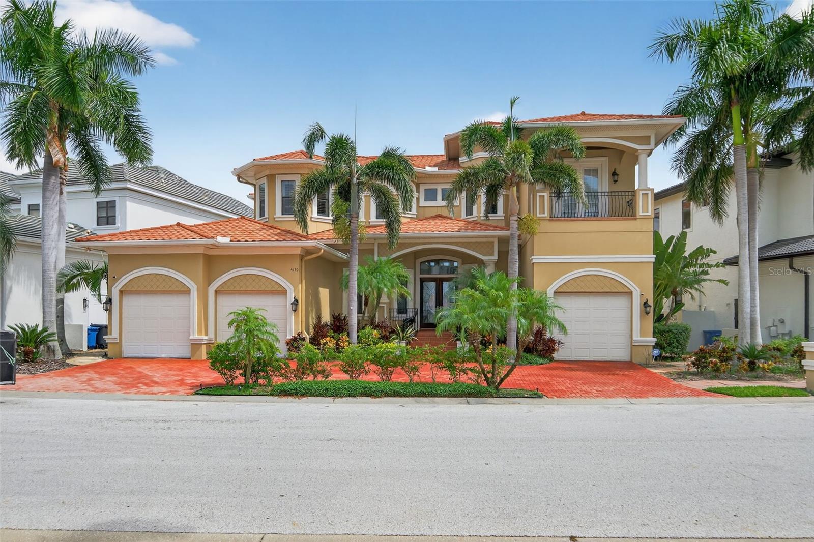 Welcome to Tampa Bay’s most desired gated waterfront community: The Reserve of Old Tampa Bay. This quiet enclave showcases some of the most breathtaking sunrises and sunsets on Florida’s West Coast. Surrounded by lush palms, private water access, and serene views of Old Tampa Bay, this home offers a rare blend of tranquility and luxury living.
Custom-built in 2006 by Alvarez Homes, this residence makes a statement the moment you arrive. Double custom entry doors open to a soaring foyer illuminated by a crystal chandelier. To the left, an elegant formal dining room sets the stage for memorable gatherings, while the formal living room offers floor-to-ceiling bay views and a Baby Grand player piano as its centerpiece. The first floor hosts a mini-owner’s suite with patio and pool access, an ensuite bath, and walk-in closet—ideal for guests or multi-generational living. A powder room features a striking floor-to-ceiling Florida mural, while a private entrance to the one-car garage offers convenience and privacy.
The chef’s kitchen is fully outfitted with luxury appliances: Wolf gas cooktop, Bosch convection oven, Profile microwave, Sub-Zero refrigerator, built-in wine chiller, and Bosch dishwasher. Custom cabinetry complements granite counters and an expansive island. Nearby, the laundry room provides access to a two-car garage with custom lift, tankless water heater, water softener, and reverse osmosis systems.
The open-concept family and dining area boasts custom built-ins framing the entertainment center and an in-house audio system. Pocketing glass sliding doors can be opened fully, blending indoor comfort with outdoor living.
Stepping out onto the expansive patio, you can't help but take in the front-row bay views. Entertain or relax beside the private heated saltwater pool or dip into the heated spa with its cascading waterfall. A poolside half-bath and sauna add resort-level convenience. The outdoor kitchen—complete with gas grill, granite bar, and counter seating—makes alfresco dining effortless. After dinner you may want to access your boat from your own private boat lift and tour the bay.
Back inside, ascend the chandelier-lit elevator and marvel at the endless tall ceilings as you exit onto the dramatic catwalk. Two guest suites feature walk-in closets, a shared Jack-and-Jill bath, and private balconies. On the other side of the catwalk you will find a spacious loft and bonus room that holds a secret entry to walk-in closet of the primary suite, where a spa-inspired bathroom awaits with separate vanities, two private water closets, a deep jetted soaking tub, and a large walk-in shower.
The Reserve of Old Tampa Bay is just minutes from Downtown Tampa, the Gulf Beaches, and Tampa International Airport. Offering both privacy and proximity, it is truly the best of both worlds.
A home of elegance, comfort, and unforgettable views—this is where your next chapter begins.