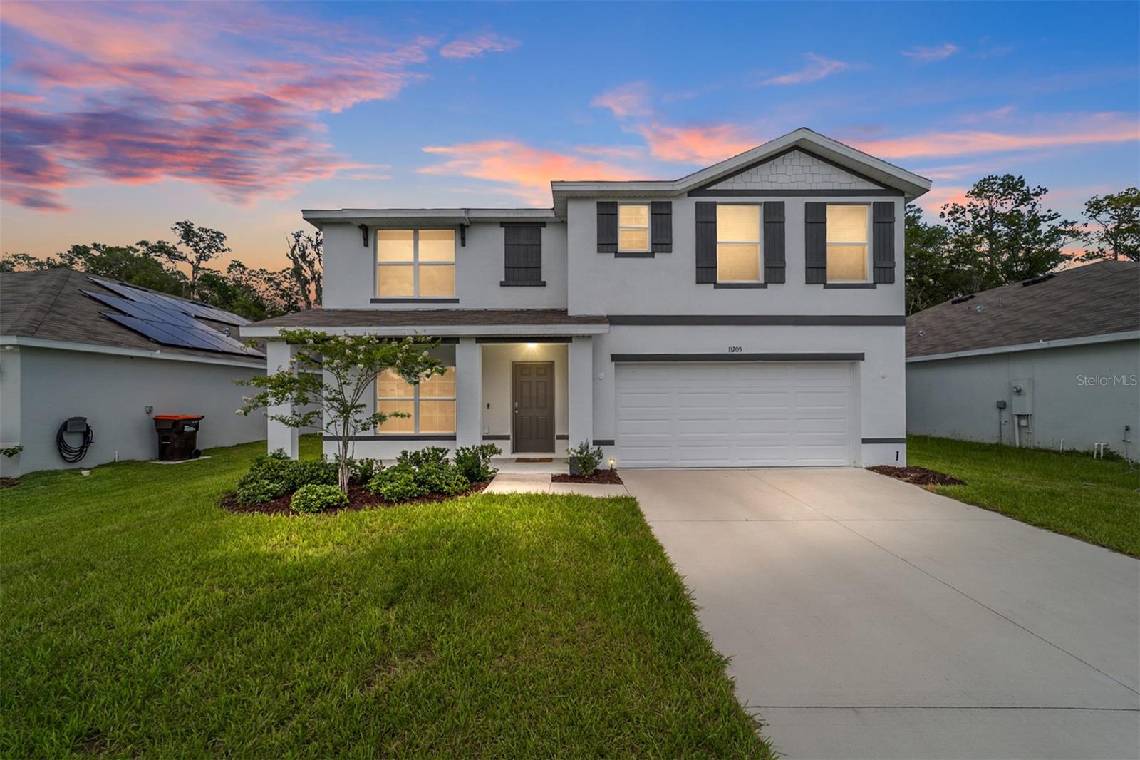 Skip the wait—this move-in ready 2023-built home in Belleview’s Autumn Glen has it all: space, style, and location!
With 5 bedrooms, 3 bathrooms, and 2,661 sq ft, this two-story home offers flexible living space perfect for families, multigenerational living, or work-from-home lifestyles. Situated between Ocala and The Villages, Autumn Glen is one of Belleview’s most desirable new communities.
The first floor features an open-concept layout with a large great room, modern kitchen with quartz countertops, stainless steel appliances, and a center island ideal for entertaining. A downstairs bedroom and full bath offer versatility for guests or office use. Upstairs, the owner’s suite features dual sinks and a walk-in closet, and three additional bedrooms including a loft surround a spacious upstairs laundry room—washer and dryer included!
Step outside and enjoy your expanded front porch, perfect for morning coffee or evening chats. The private backyard has no rear neighbors and offers room to relax, play, or garden.
Features & Highlights:
• 2023 concrete block construction
• Expanded front porch with curb appeal
• Quartz countertops & stainless steel appliances
• Smart home technology and energy-efficient design
• Washer & dryer included
• No CDD fees and low HOA
• Community dog park and tot lot
• USDA financing eligible
• Centrally located between Ocala & The Villages—minutes to shopping, dining, and recreation
This is one of the most desirable floorplans in Autumn Glen—and it’s ready now. Don’t miss your opportunity to own a nearly new home with all the extras!