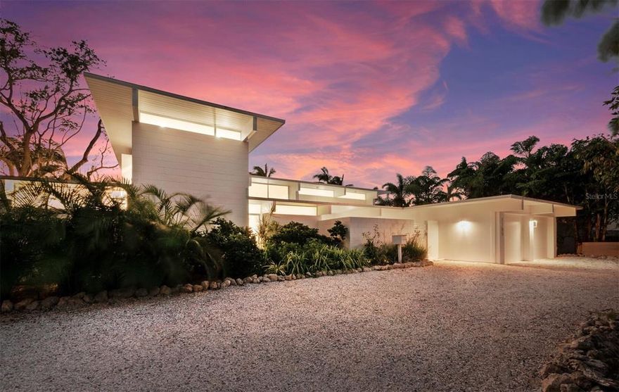 Renowned architect, William Rupp, created this gem in 1965 as one of the newer, mid-century modern style homes in Sarasota's iconic Lido Shores neighborhood.  Recently added to the National Register of Historic Places, this home showcases the Sarasota School of Architecture's affinity for open floor plans, an abundance of windows, and indoor-outdoor living.  While preserving the original features characteristic of the period, including terrazzo floors, exposed concrete block walls, and wood panel ceilings and beams, the current owners recently updated the kitchen and baths in keeping with the modernistic design.  It is fabulous!  A private courtyard entry welcomes your guests and tropical gardens surround the home with concrete block walls adding privacy and interest to the design. The interior feels even larger than its footprint due to the openness of rooms and walls of windows.  The primary bedroom and main rooms of the home overlook the sun kissed backyard and pool which is perfectly fitting for hosting a 1960's Palm Springs, Hollywood celebrity soiree!  4 bedrooms/4 ensuite baths, large kitchen overlooking the living areas, glamourous owner's suite, fireplaces in the great room and upstairs guest suite, well equipped kitchen and laundry room, two car garage.  Lido Shores homeowners enjoy private, deeded access to Lido Beach, sidewalk one mile to St. Armands, and easily accessible to Longboat Key and downtown Sarasota restaurants, dining, shopping, and culture.