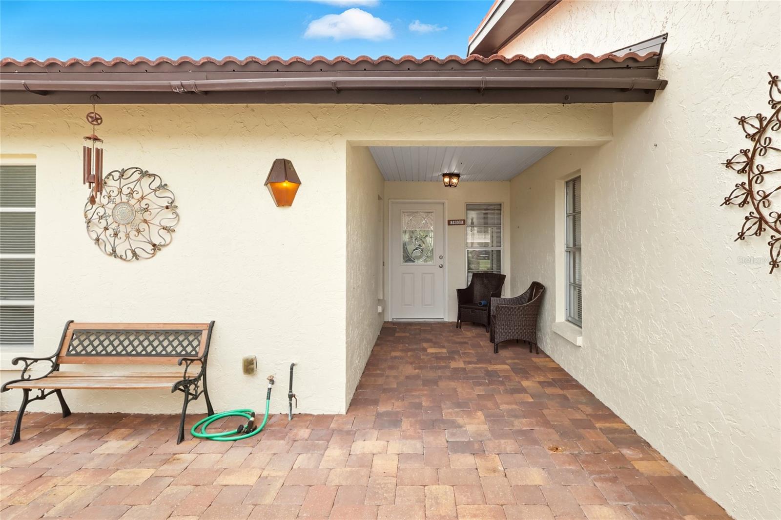 Welcome to this beautifully maintained villa nestled in the heart of Village Plaza. Offering 1,498 heated square feet of comfortable living space, this two-bedroom, two-bath home combines spaciousness with convenience. Step inside to discover a bright and open floor plan, for both relaxing and entertaining. The generously sized living and dining areas flow seamlessly, while the well-appointed kitchen provides ample cabinetry and counter space for all your culinary needs. The primary suite features a private bath and plenty of closet space, while the second bedroom is ideal for guests or a home office. Enjoy peaceful mornings or cozy evenings in the enclosed lanai, adding a touch of Florida charm to your everyday living. Located just minutes from shopping, dining, and medical facilities, this villa offers the perfect blend of tranquility and accessibility. Whether you're downsizing, investing, or searching for your forever home, this Village Plaza gem is a must-see!