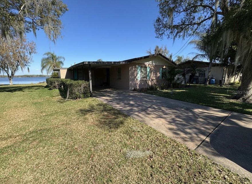 Rare waterfront opportunity on the shores of Bonnet Lake in Haines City, FL! This unique 3 bedroom, 2 bathroom property offers an exceptional 75 feet of direct lake frontage in the back AND 75 feet of canal frontage in the front, giving you the best of both worlds. Whether you're relaxing on your private dock overlooking Bonnet Lake or pulling your boat into the covered boat lift on the canal side, this home delivers the waterfront lifestyle at every turn. Nestled in a peaceful, quiet setting, this is your chance to own a true lakehouse retreat and make it your own. With vision and updates, this property has all the bones to become a stunning waterfront showpiece. Opportunities like this — dual water frontage, a private dock, and a covered boat lift — rarely come to market. Don't miss your chance to create your dream lake escape!