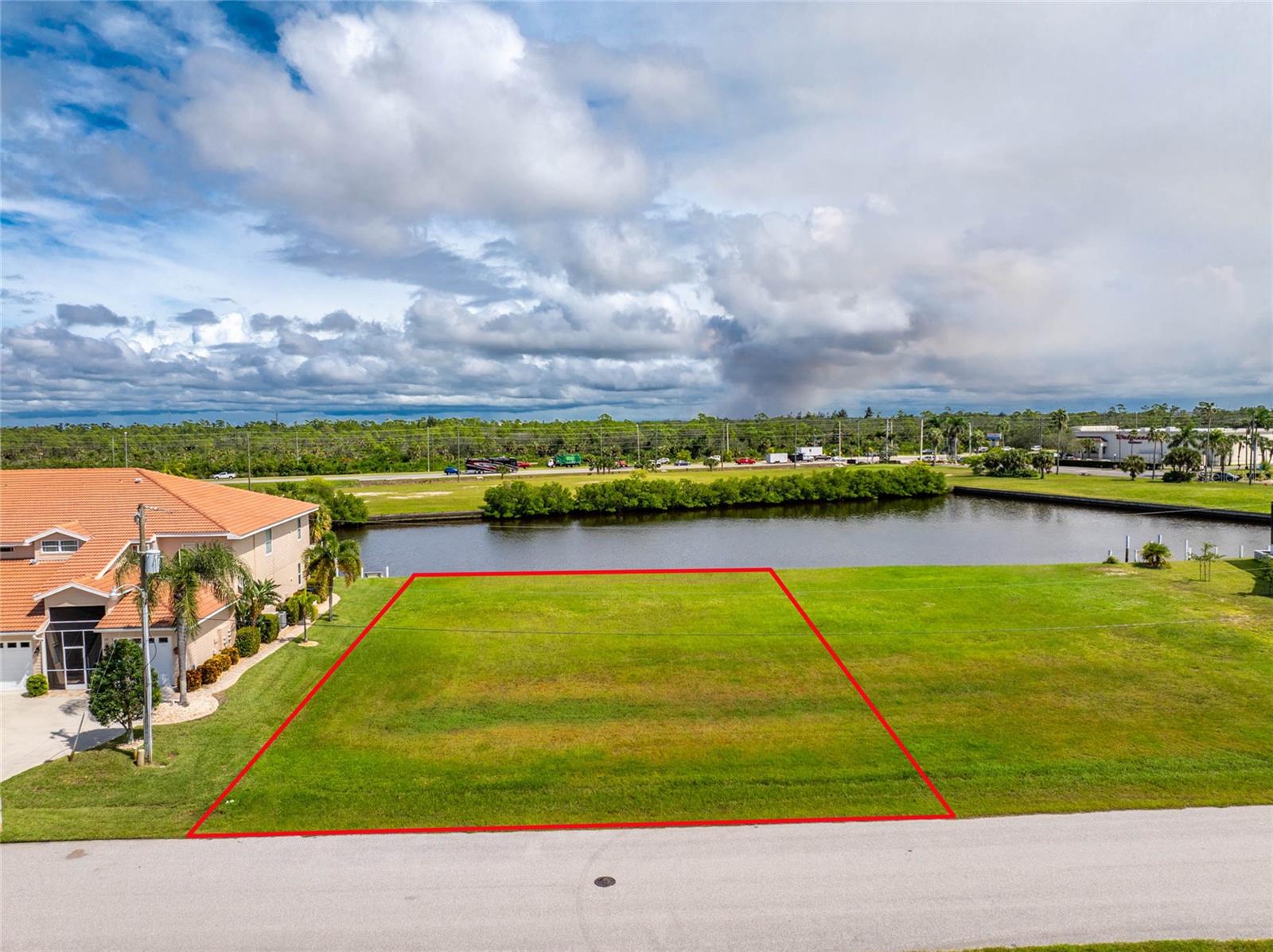 Builders and Investors, HURRY, these exceptional lots are rarely available. Build a single-family home or four-plex. The beautiful improved lot features 110 feet of waterfront with a concrete seawall on a wide canal. Sailboat access via Alligator Creek to Charlotte Harbor, leading to the Gulf of America. Situated on a large turning basin for easy docking. All public utilities are available in BURNT STORE ISLES, a Deed-Restricted, Boating and Golf Community, Near the Punta Gorda Airport.